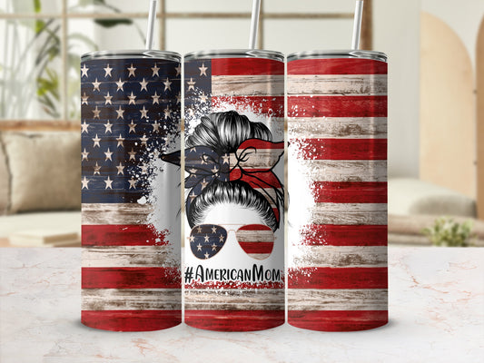 Messy bun mom with sunglasses on American flag tumbler.
