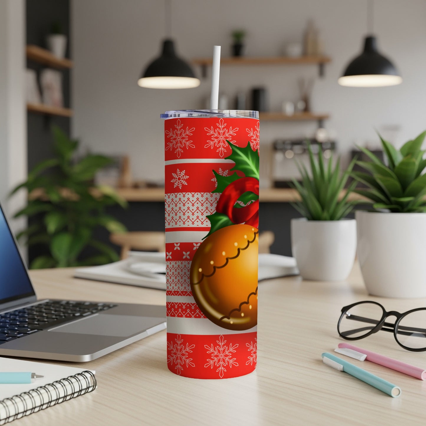 Christmas ornament and snowflake patterned tumbler with straw.