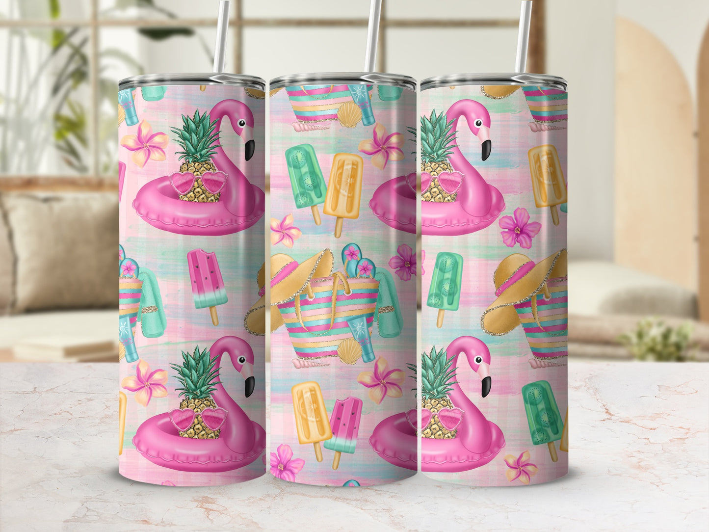 Three tumblers with a pink flamingo, pineapple, and beach-themed pattern.
