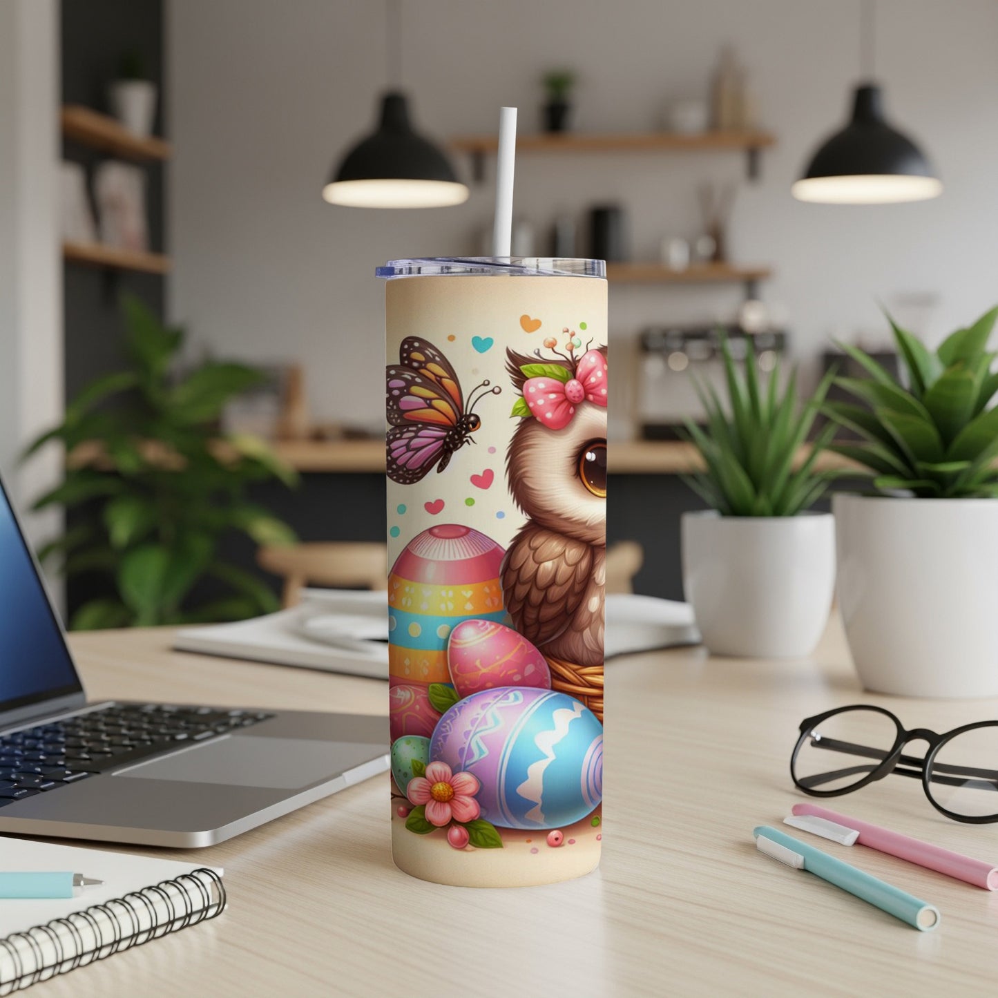 Cartoon owl with butterfly and Easter eggs on a patterned tumbler.