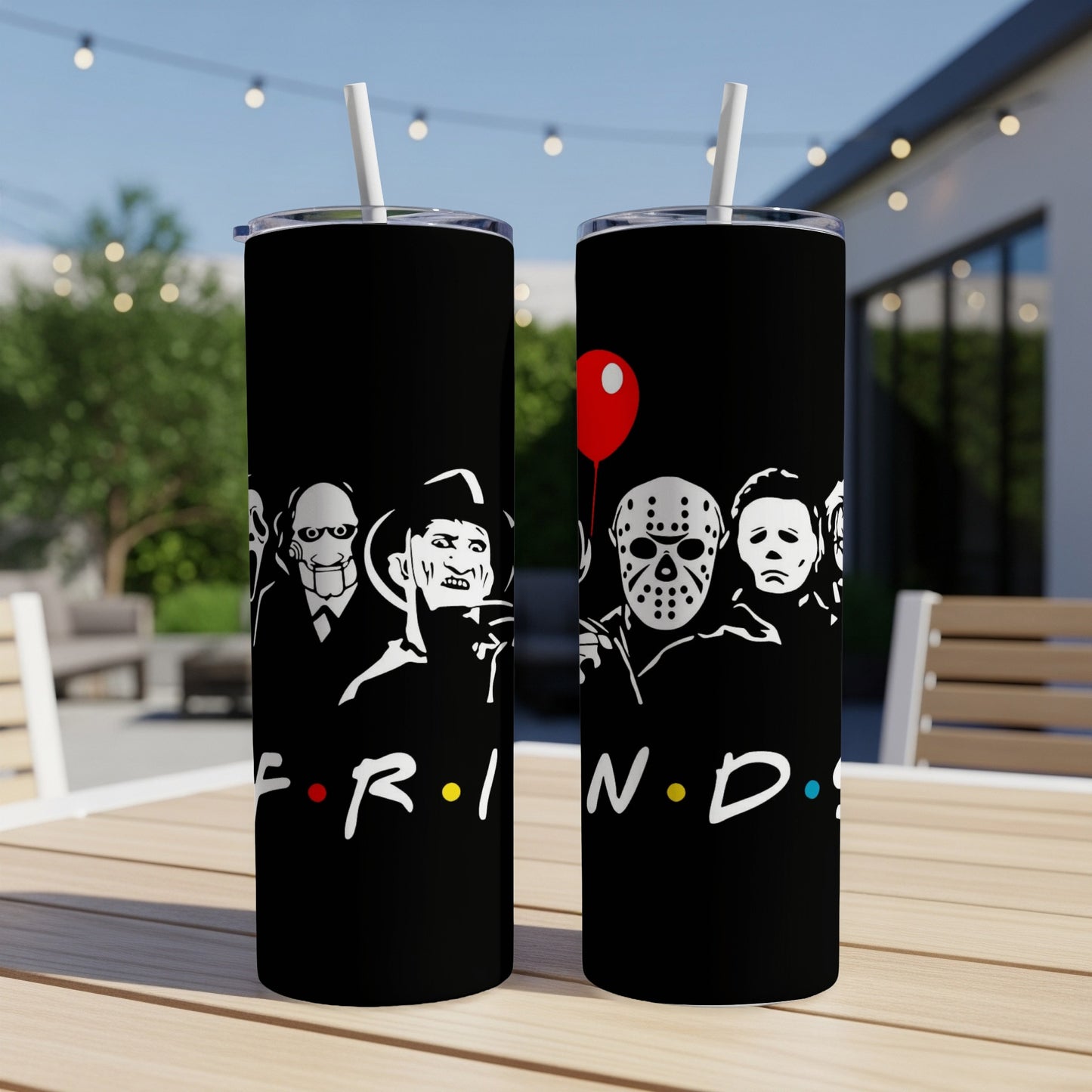 Black tumblers featuring horror movie icons and the Friends logo with a red balloon.
