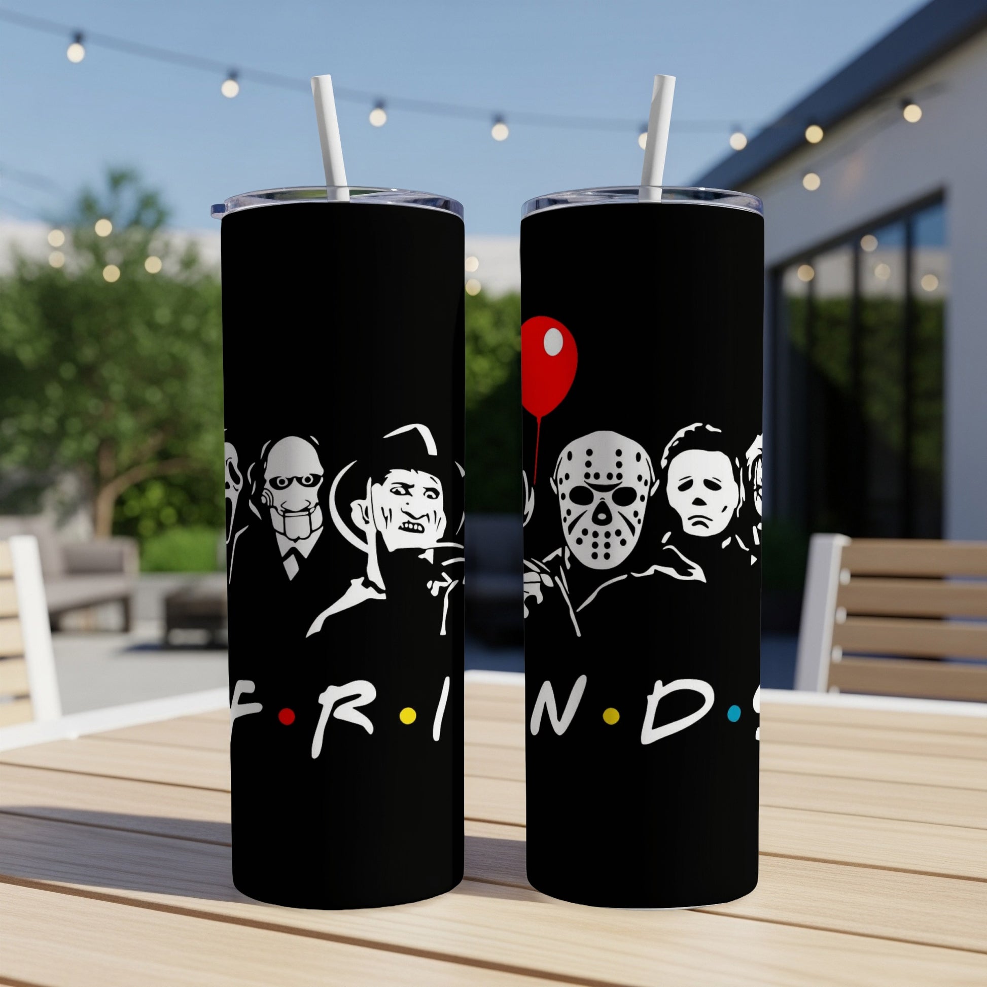 Black tumblers featuring horror movie icons and the Friends logo with a red balloon.
