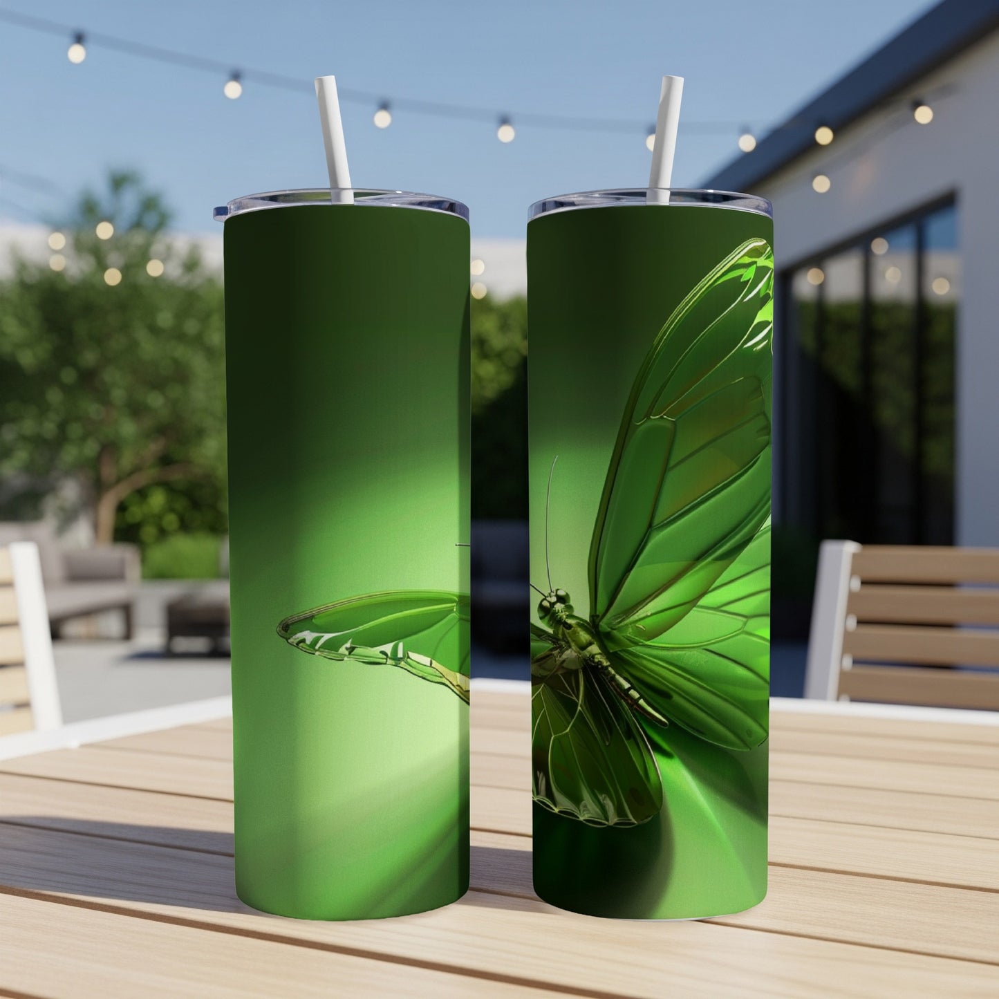 Two green tumblers with a detailed butterfly design.