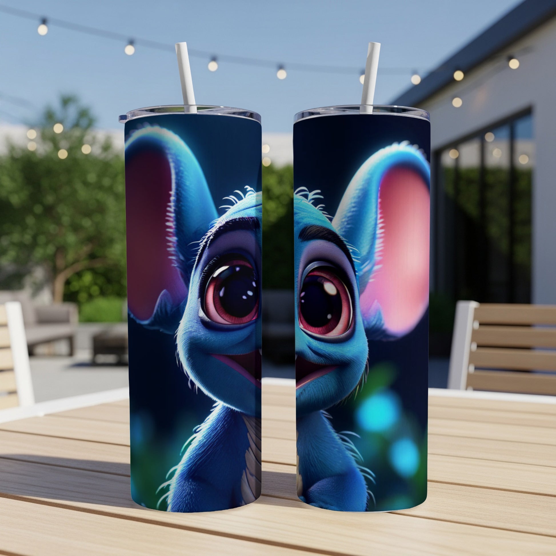 Blue alien character with large eyes on two tumblers on a table.