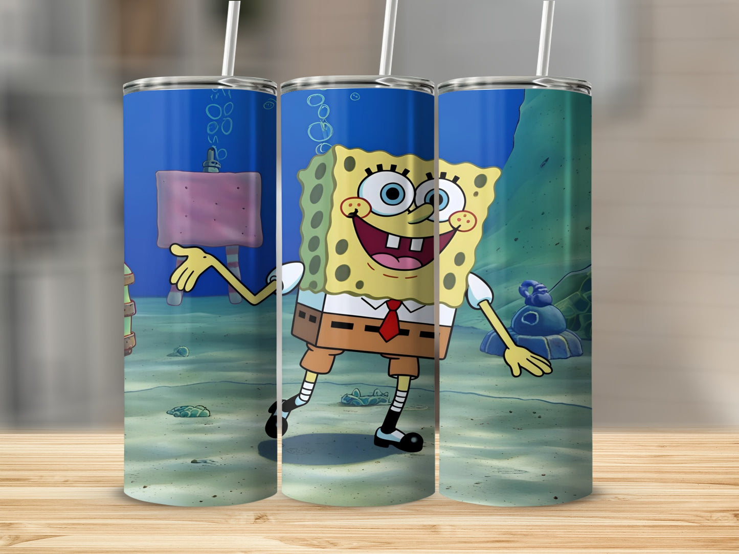 SpongeBob SquarePants character smiling on a blue tumbler with straw.