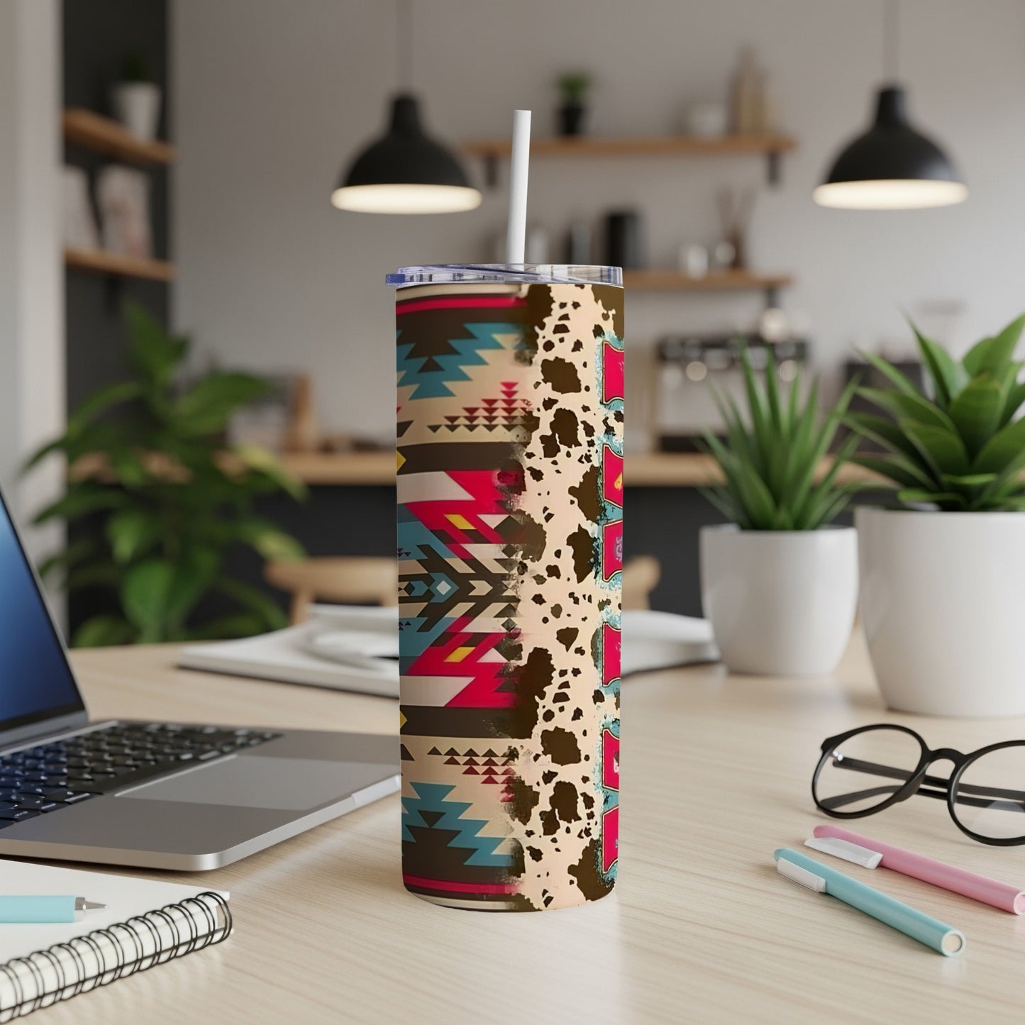 Tumbler with Western geometric pattern and cowhide print.