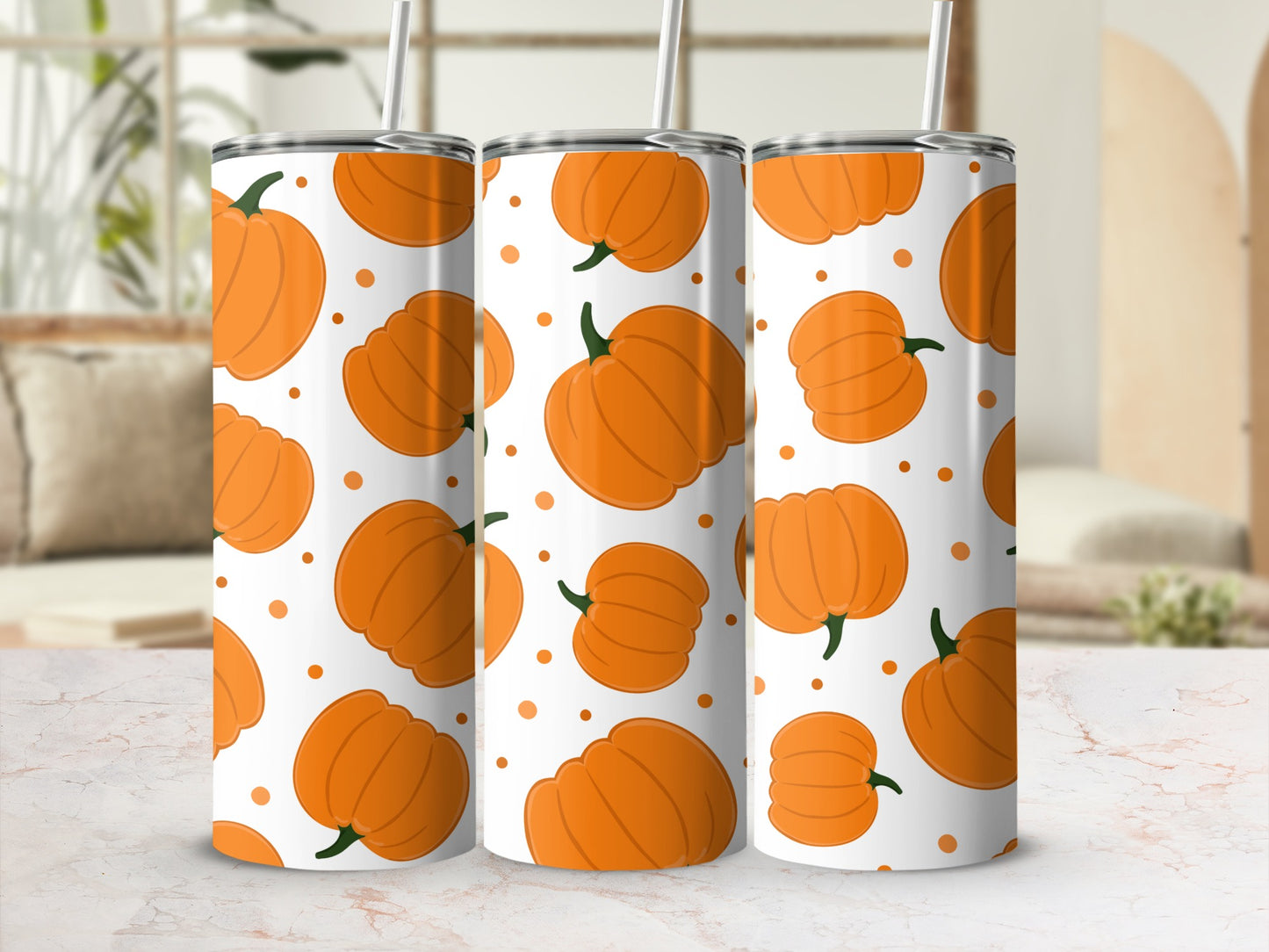 Three tumblers with a repeating pattern of orange pumpkins on a white background.