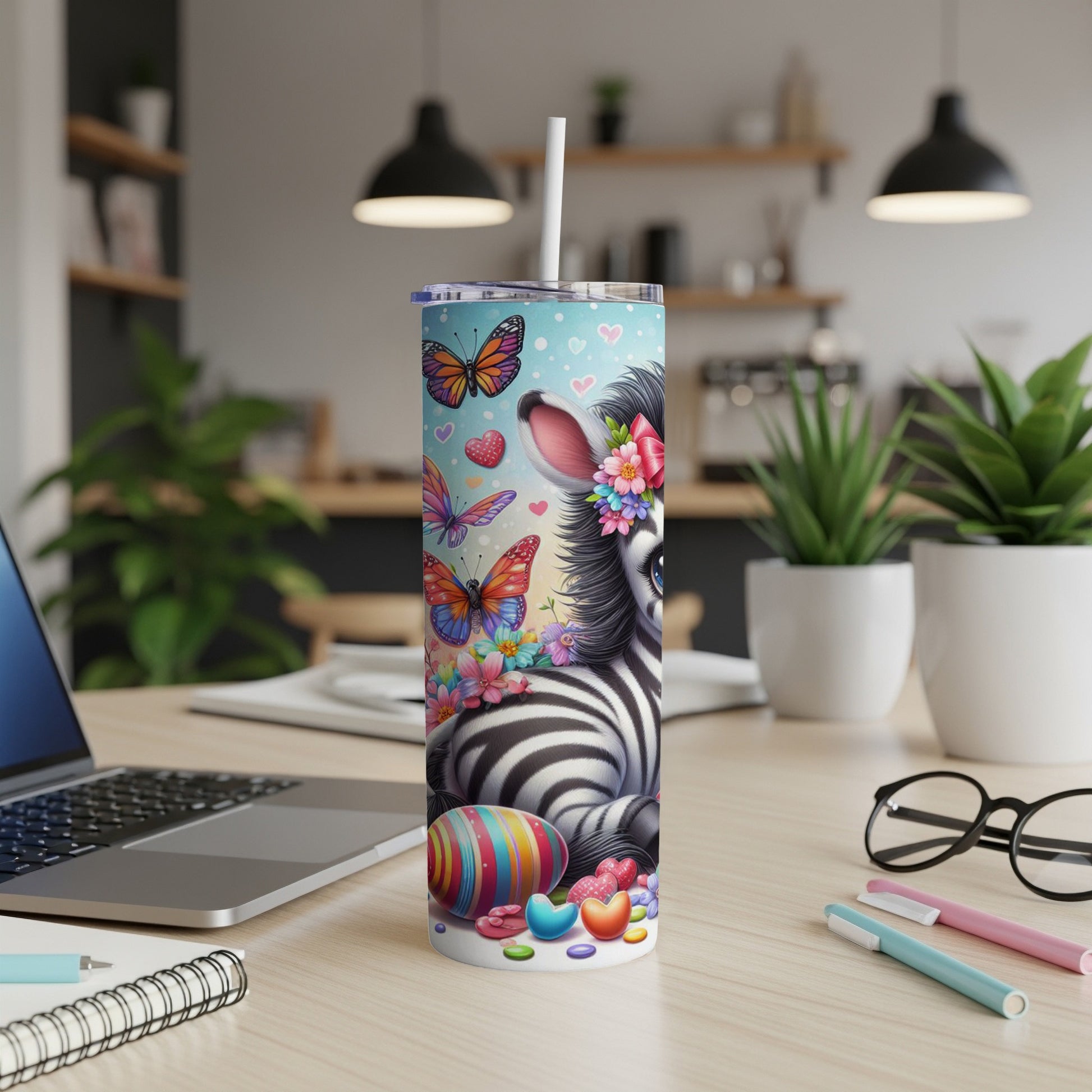 Zebra with butterflies and Easter eggs on a blue background, on a tumbler.