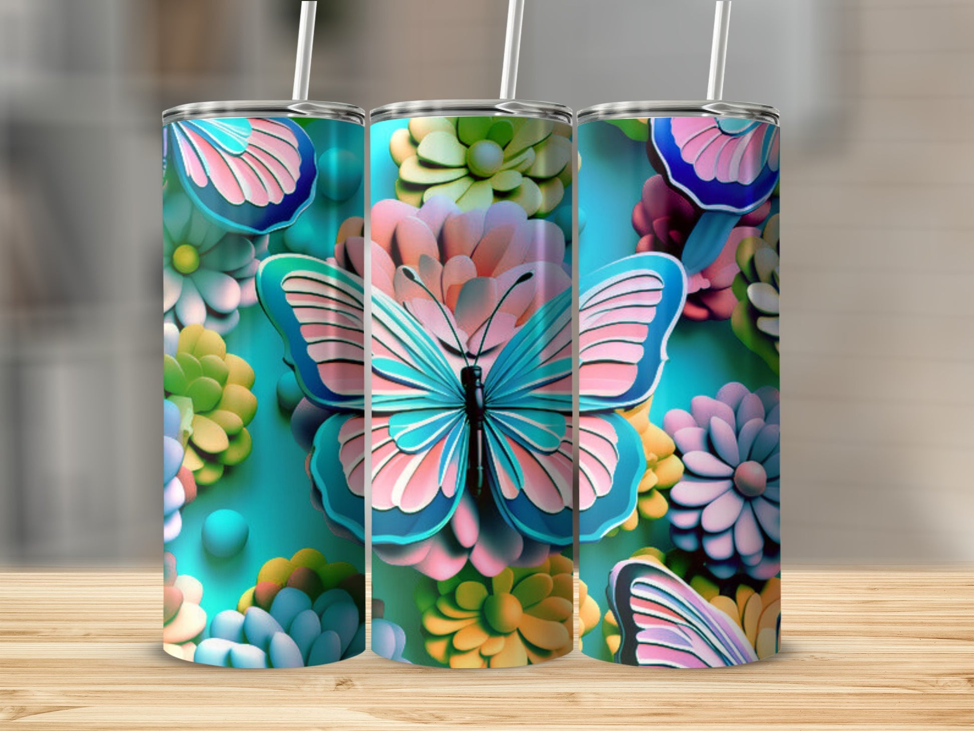 Turquoise tumbler with a large pink and blue butterfly and floral designs.