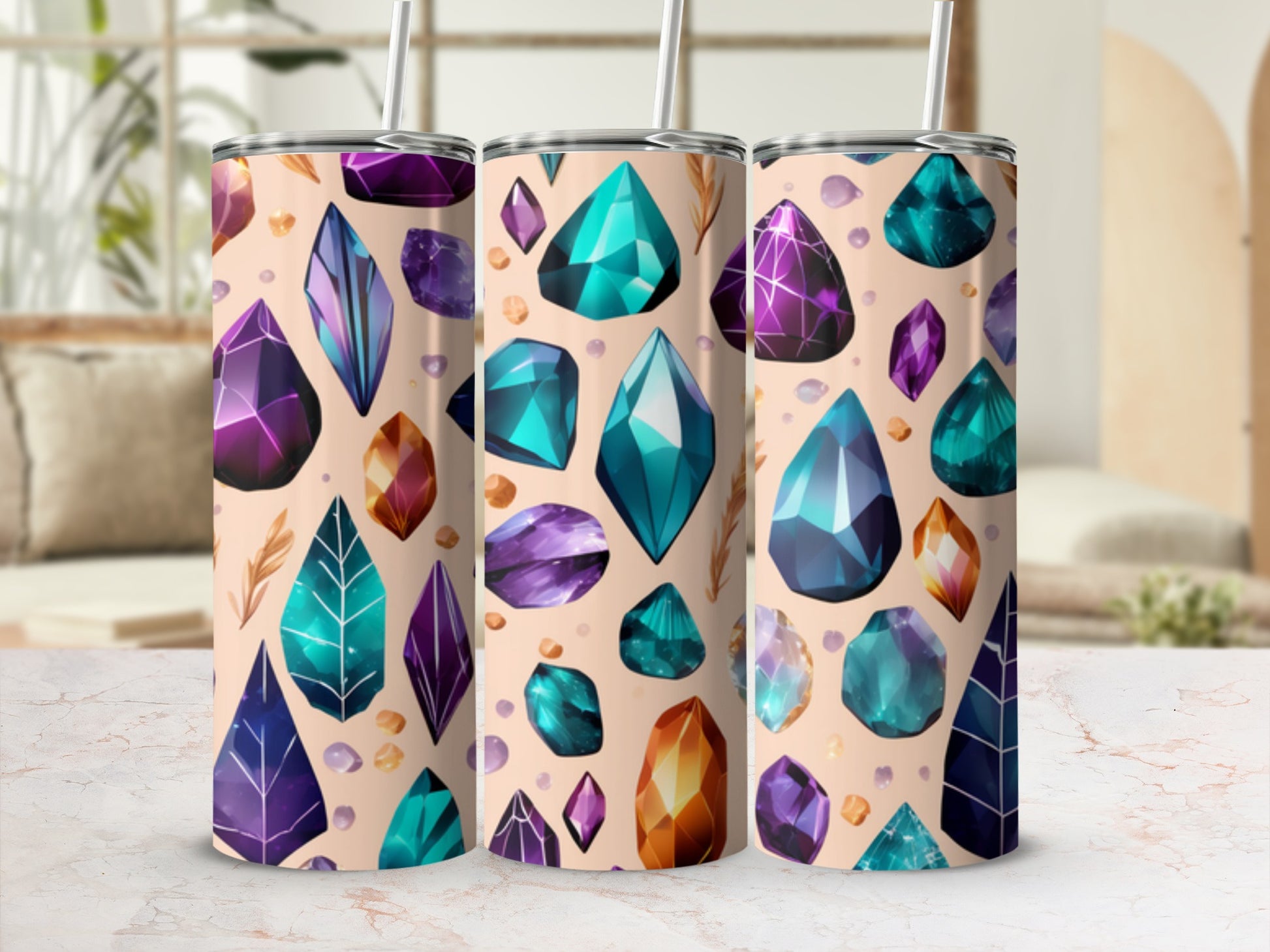 Tumblers with colorful crystal and feather patterns on a light background.