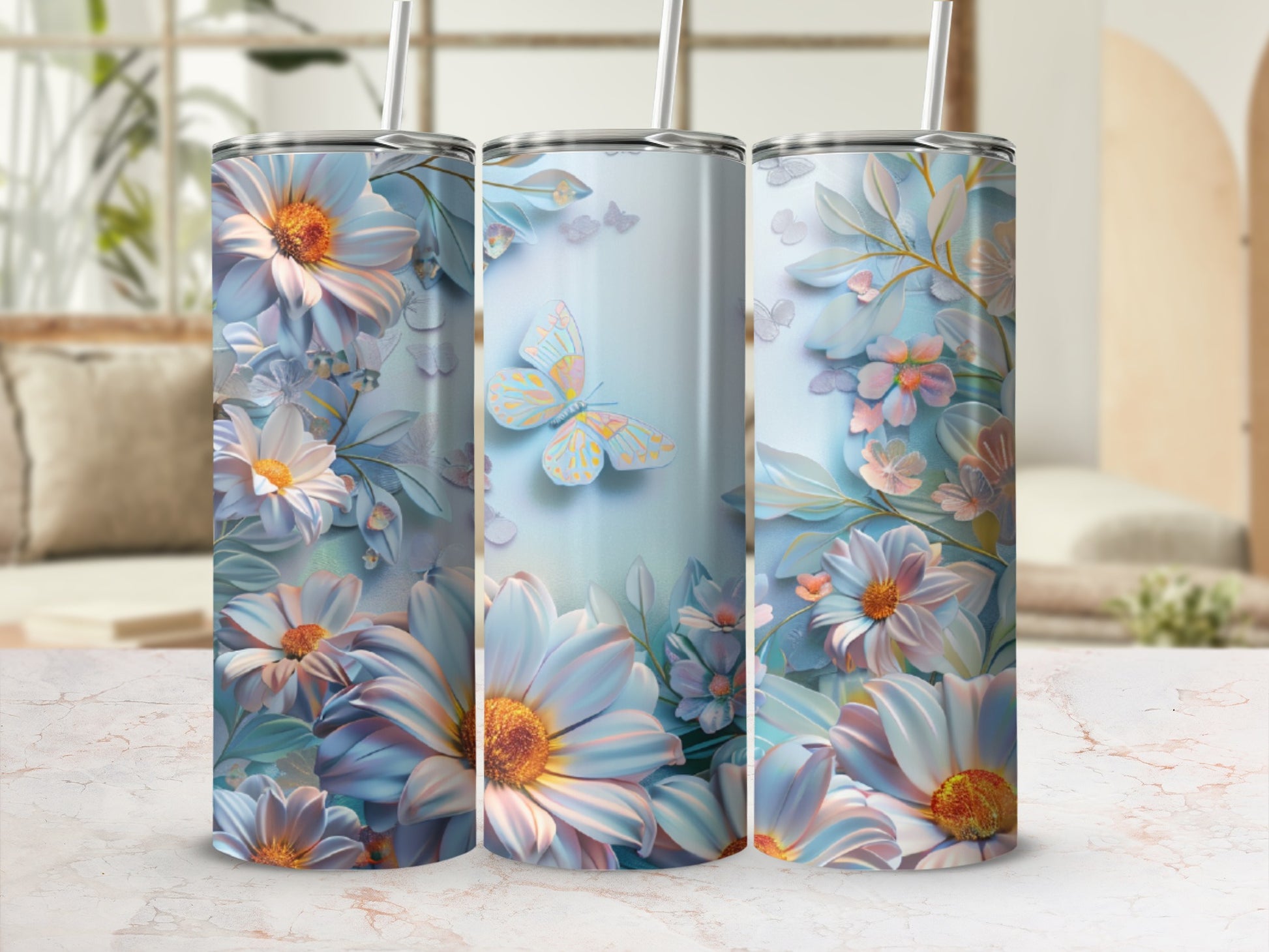 Floral and butterfly design on a set of three insulated tumblers.