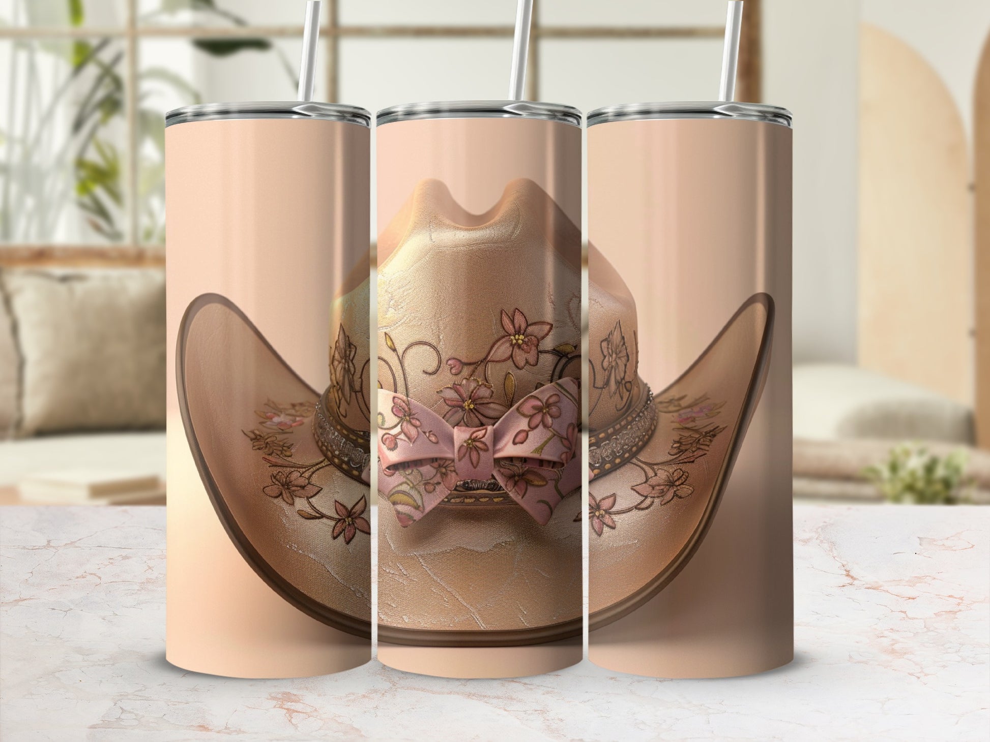 Cowboy hat with floral design and pink bow, displayed on a marbled surface.