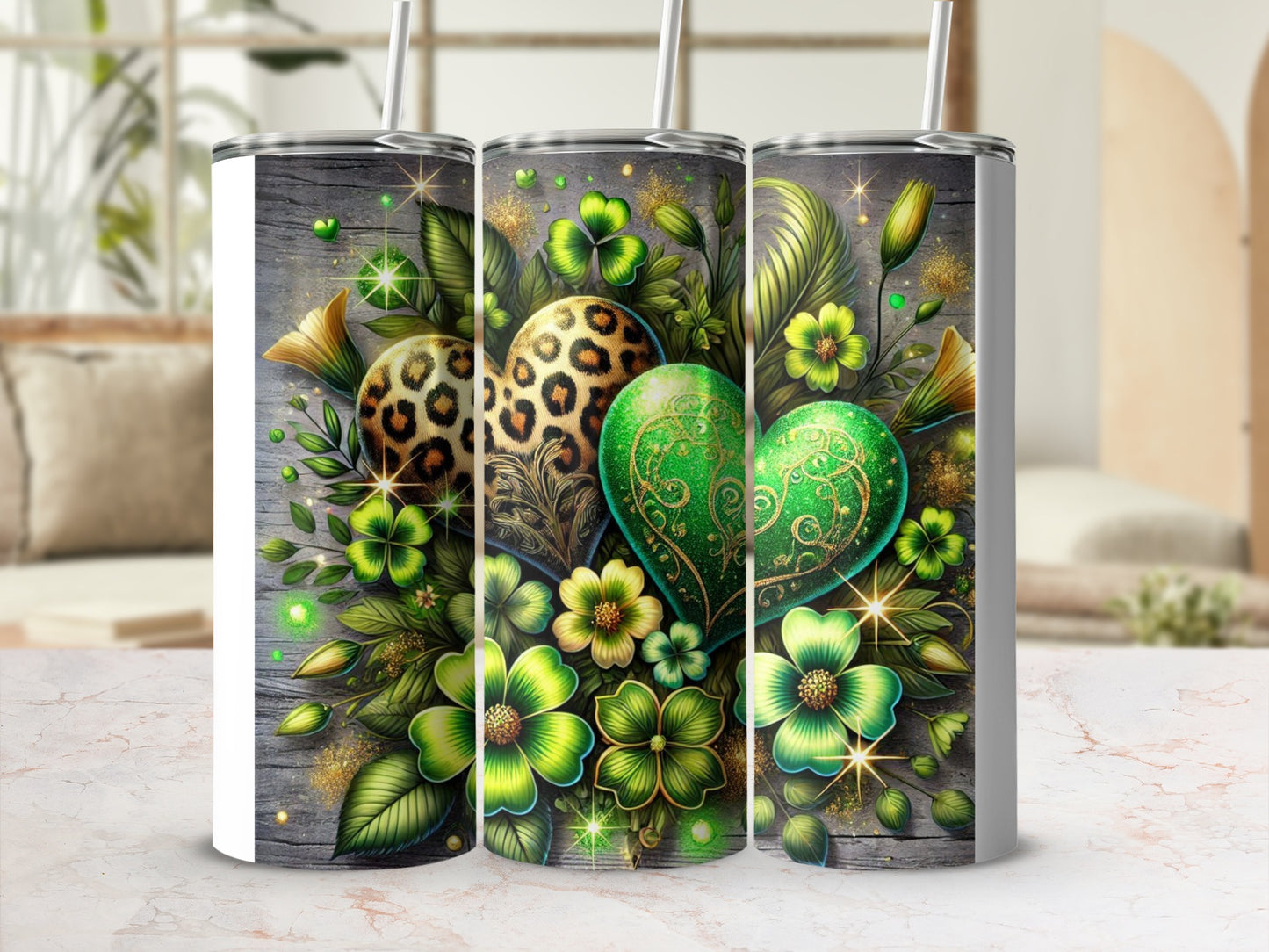 Three tumblers with green floral and leopard print heart designs.