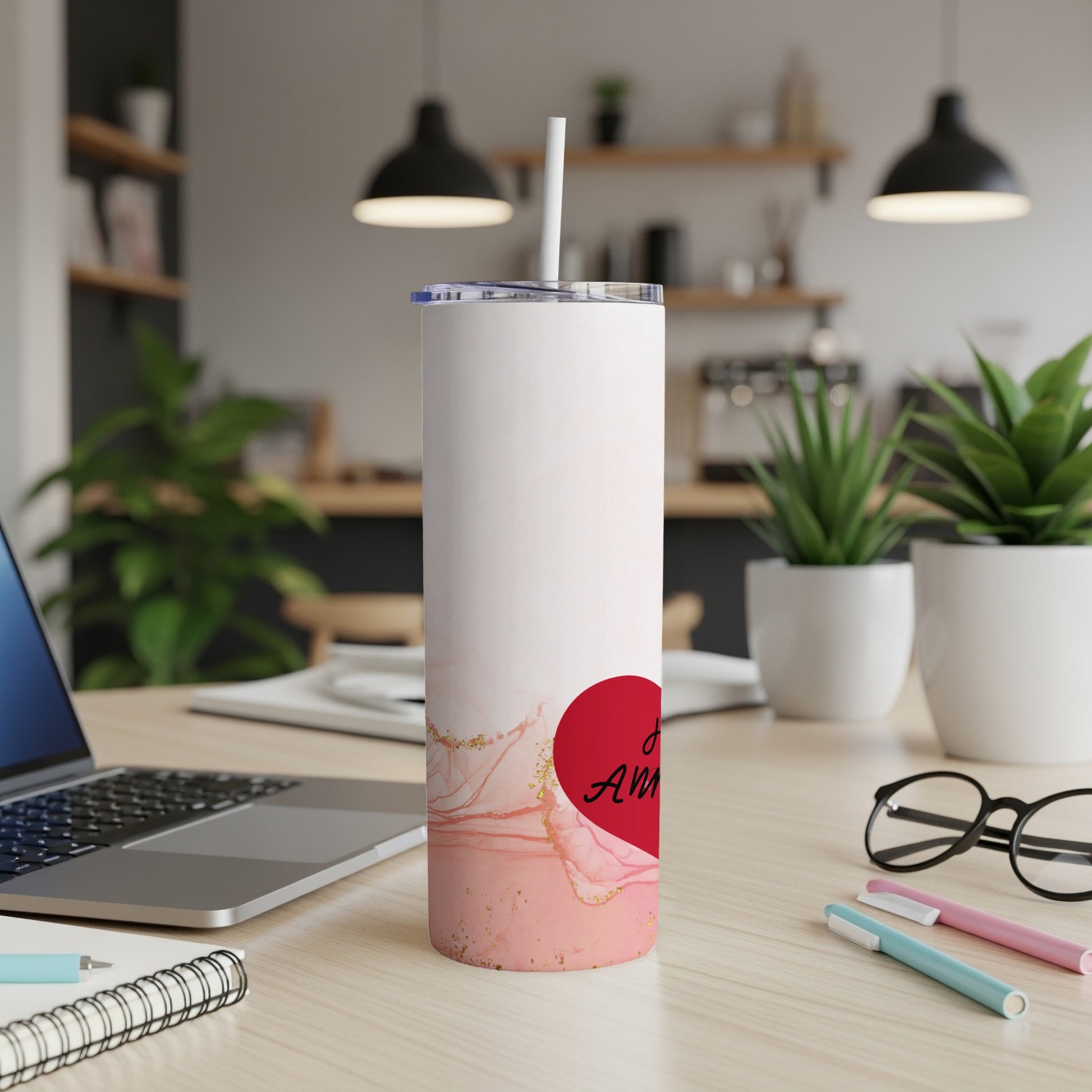 White tumbler with pink marble design and "Anniversary" text.
