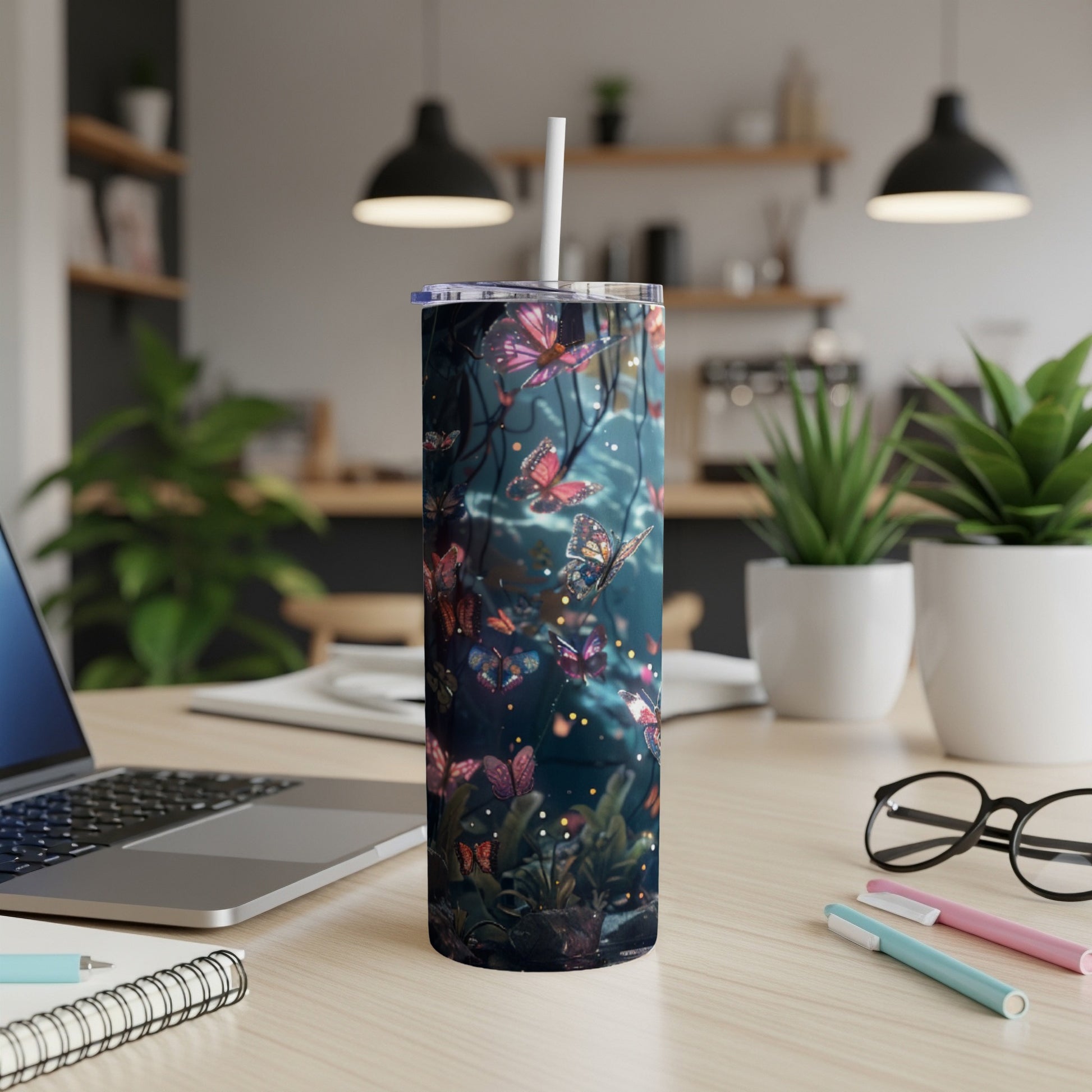 Tumbler with vibrant, glowing butterflies and dark foliage pattern.
