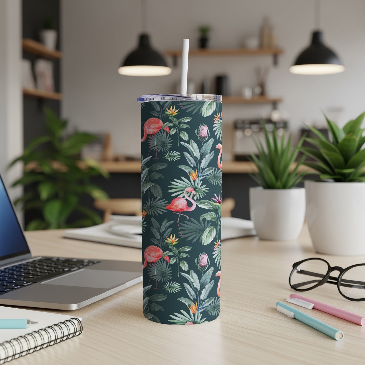 Dark green tumbler with flamingos and tropical leaves, white straw.