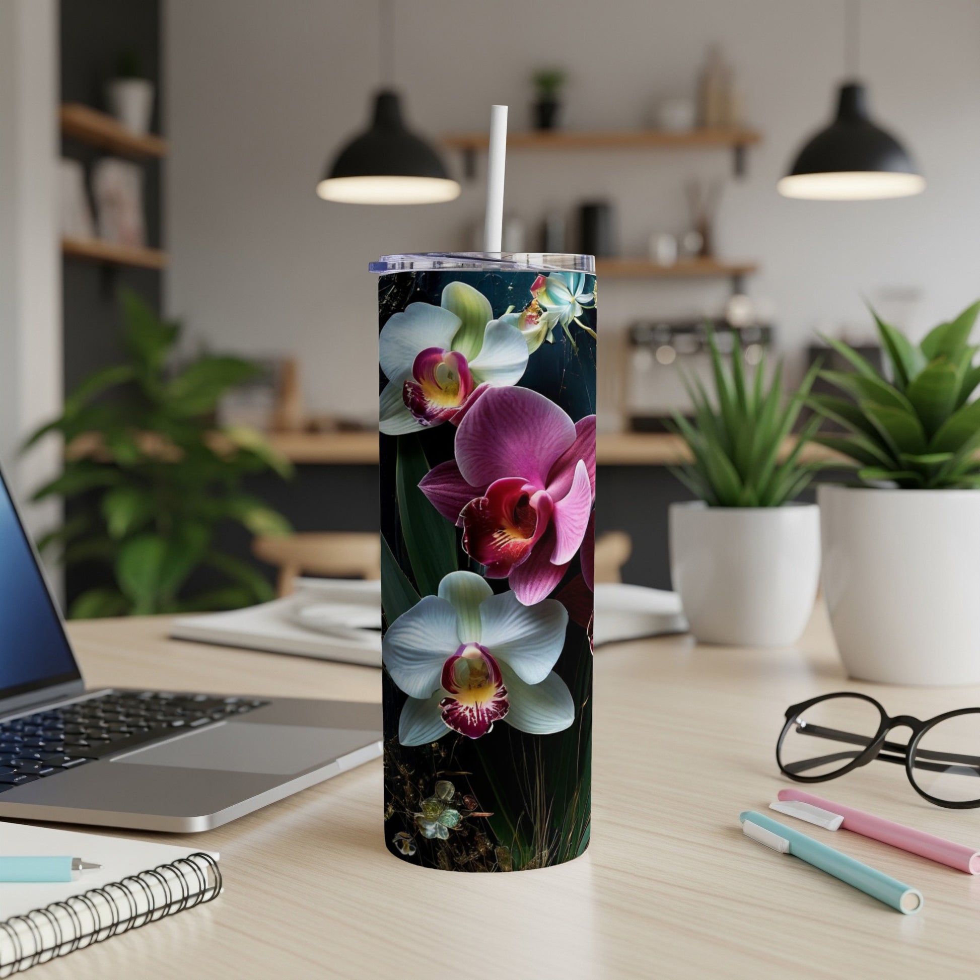 Tumbler with large pink and white orchids against a dark background.