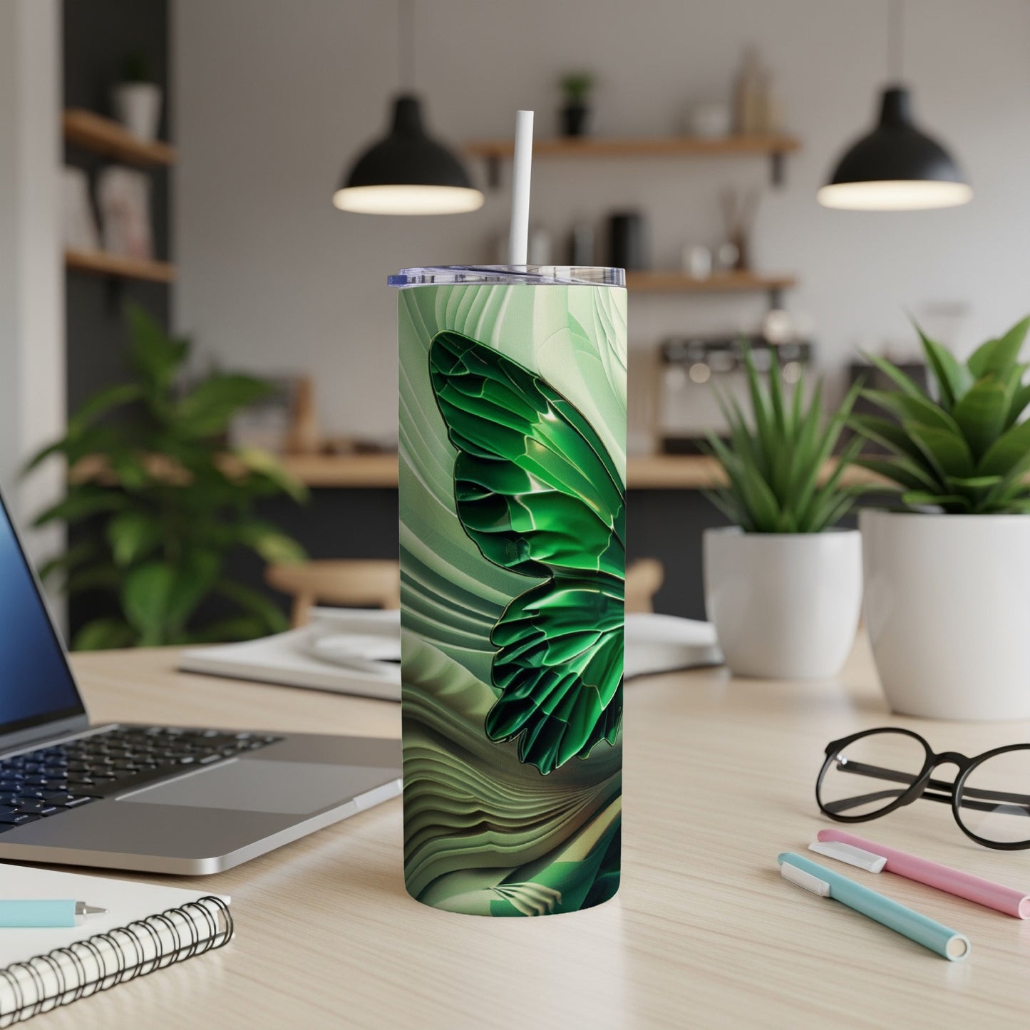 Green iridescent butterfly design on a white tumbler with a straw.