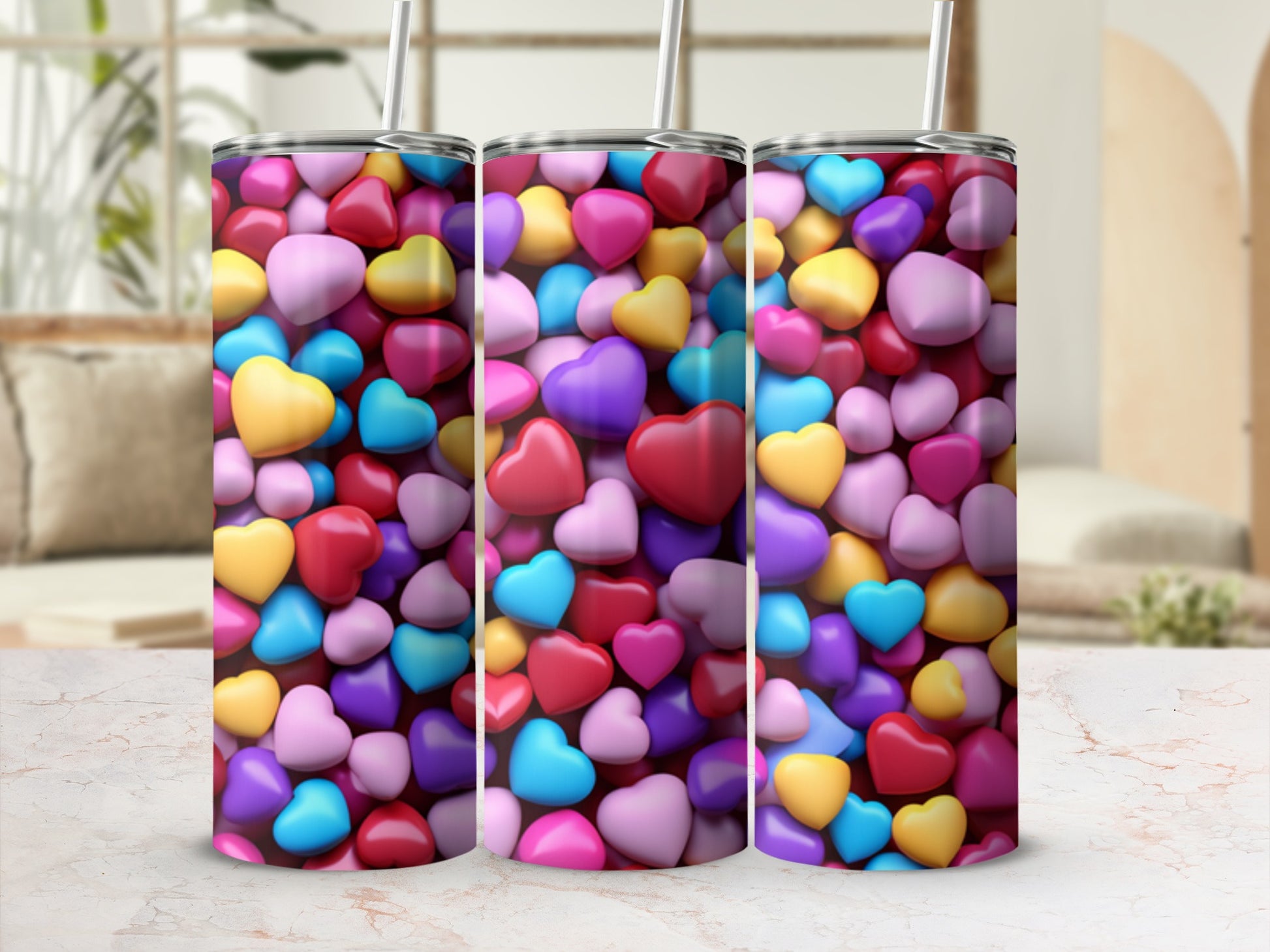Three tumblers featuring a colorful pattern of small, glossy hearts.