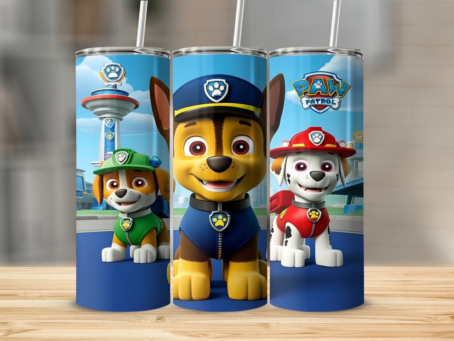 Three Paw Patrol characters, Chase, Marshall, and Rubble, on a blue tumbler design.