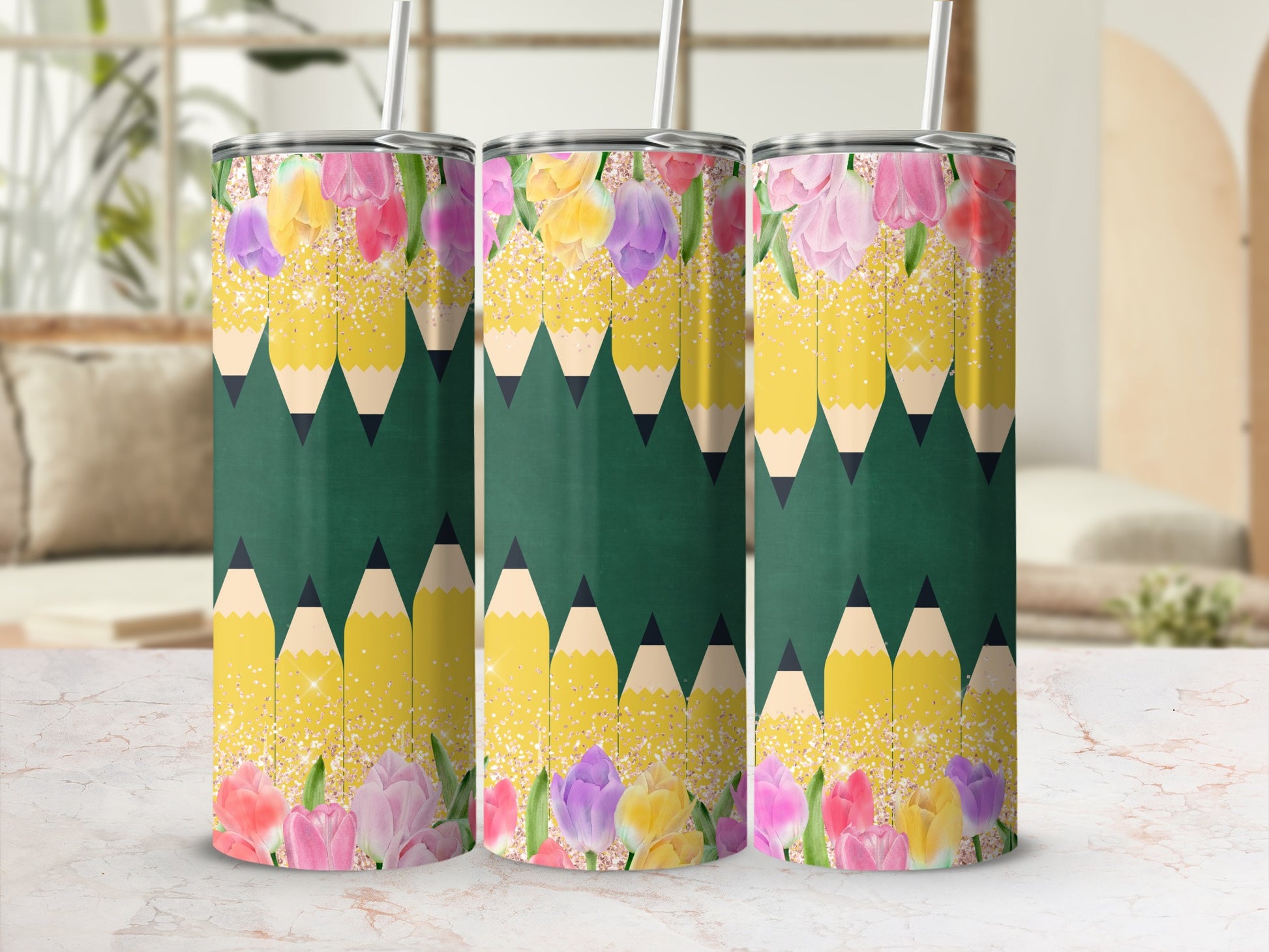 Three tumblers with a floral and pencil design.