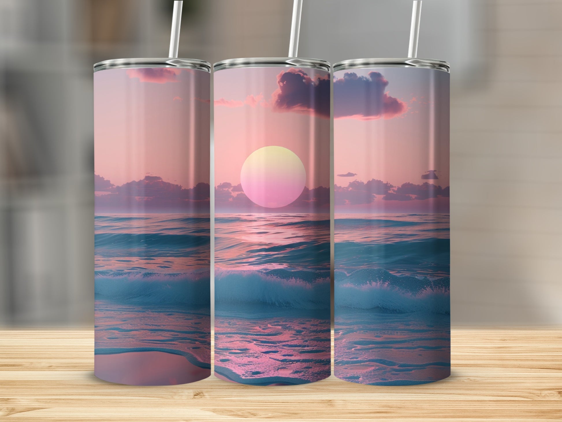 Three tumblers showing a sunset over ocean waves and clouds.