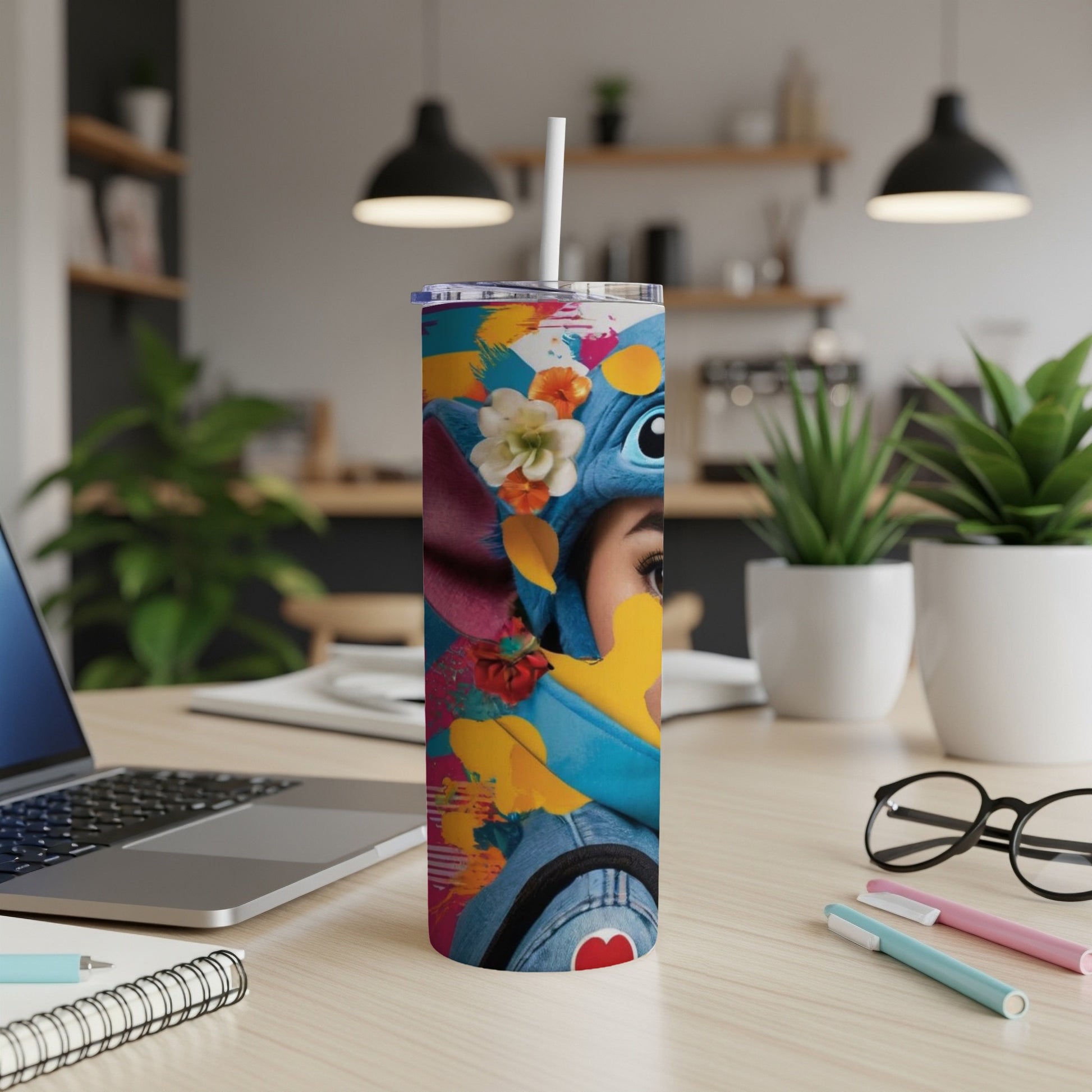 Stitch character art on a blue and floral pattern insulated tumbler with straw.