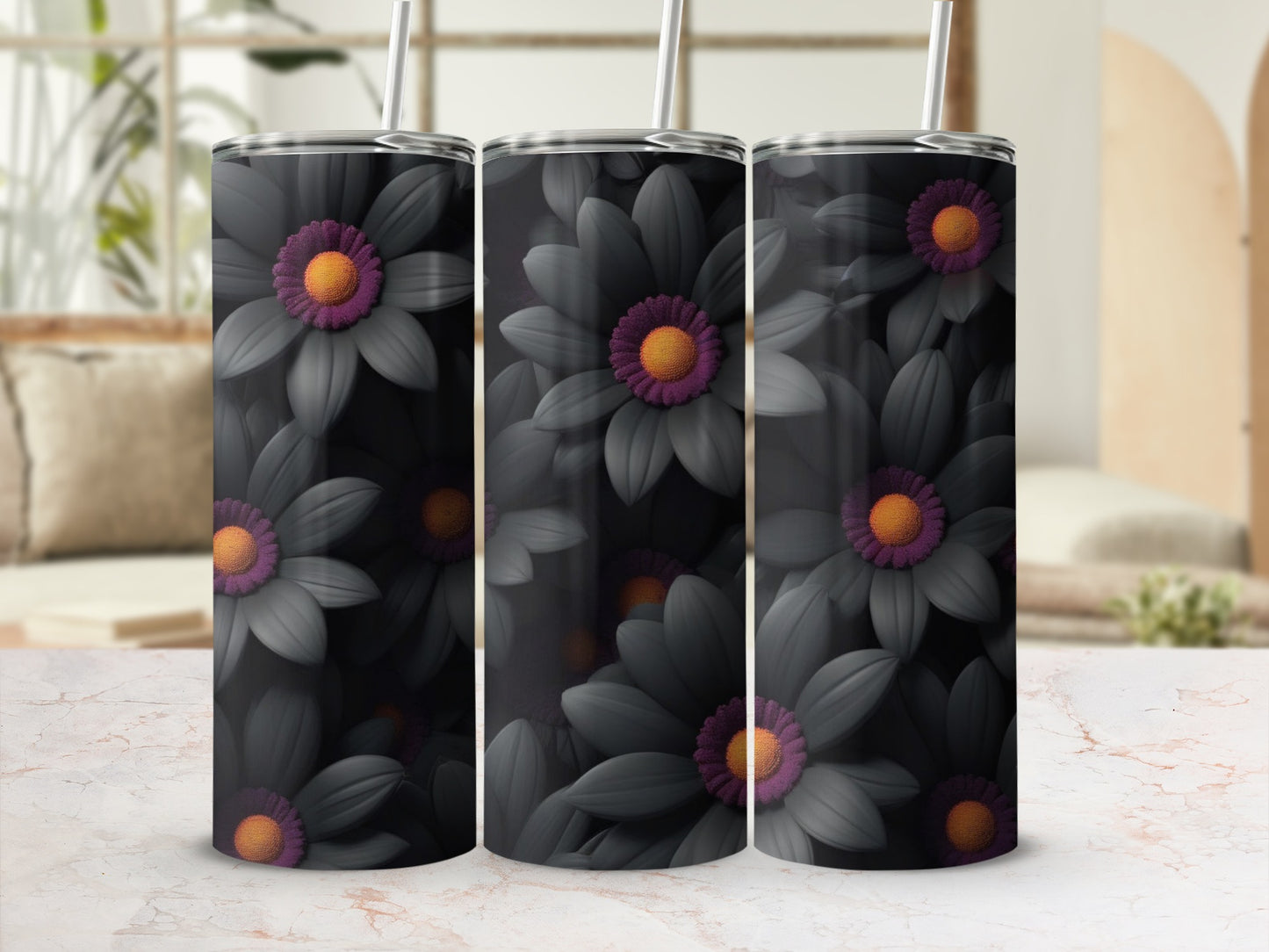 Three dark floral tumblers with orange centers on a marbled surface.