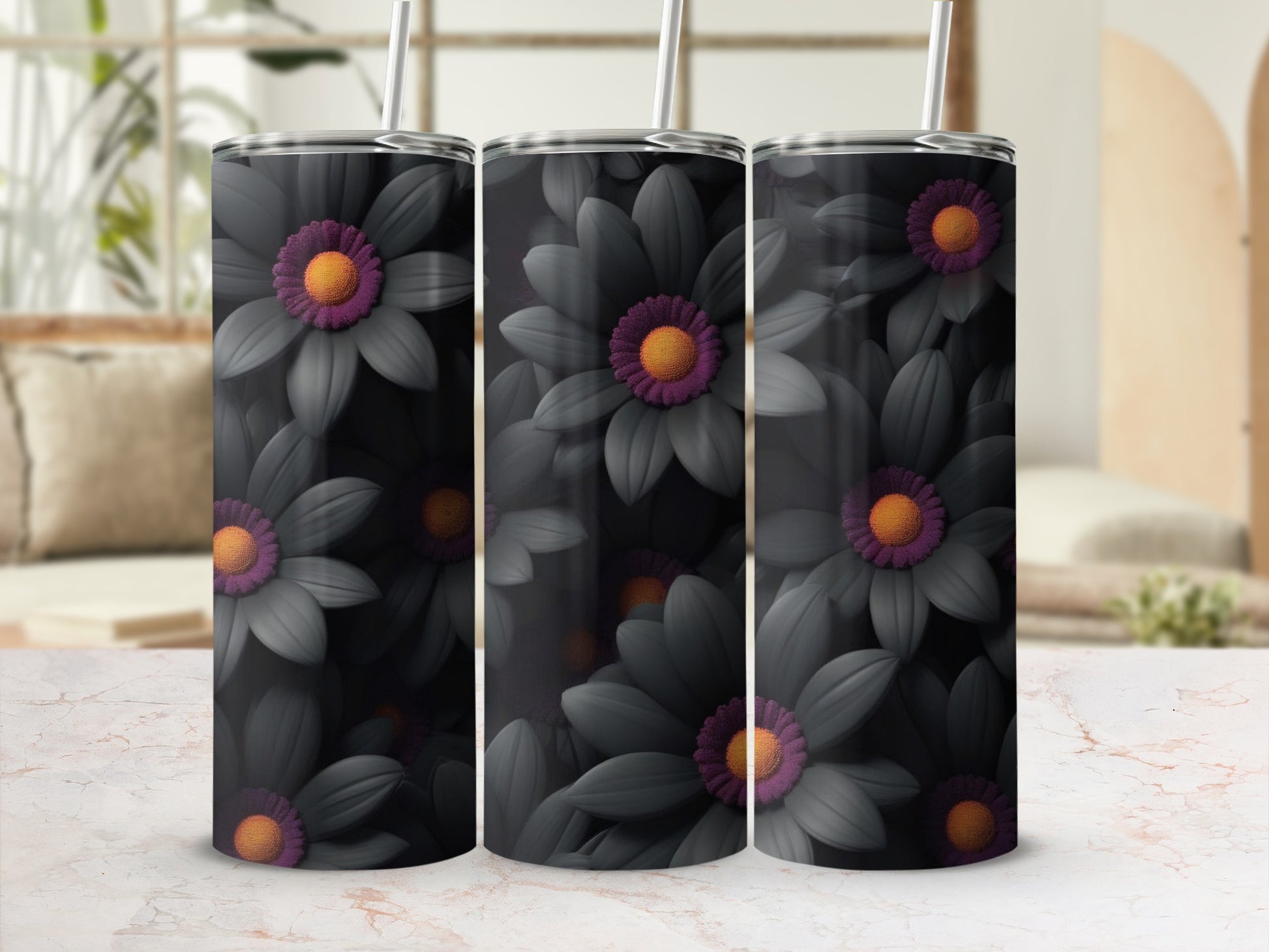Three dark floral tumblers with orange centers on a marbled surface.