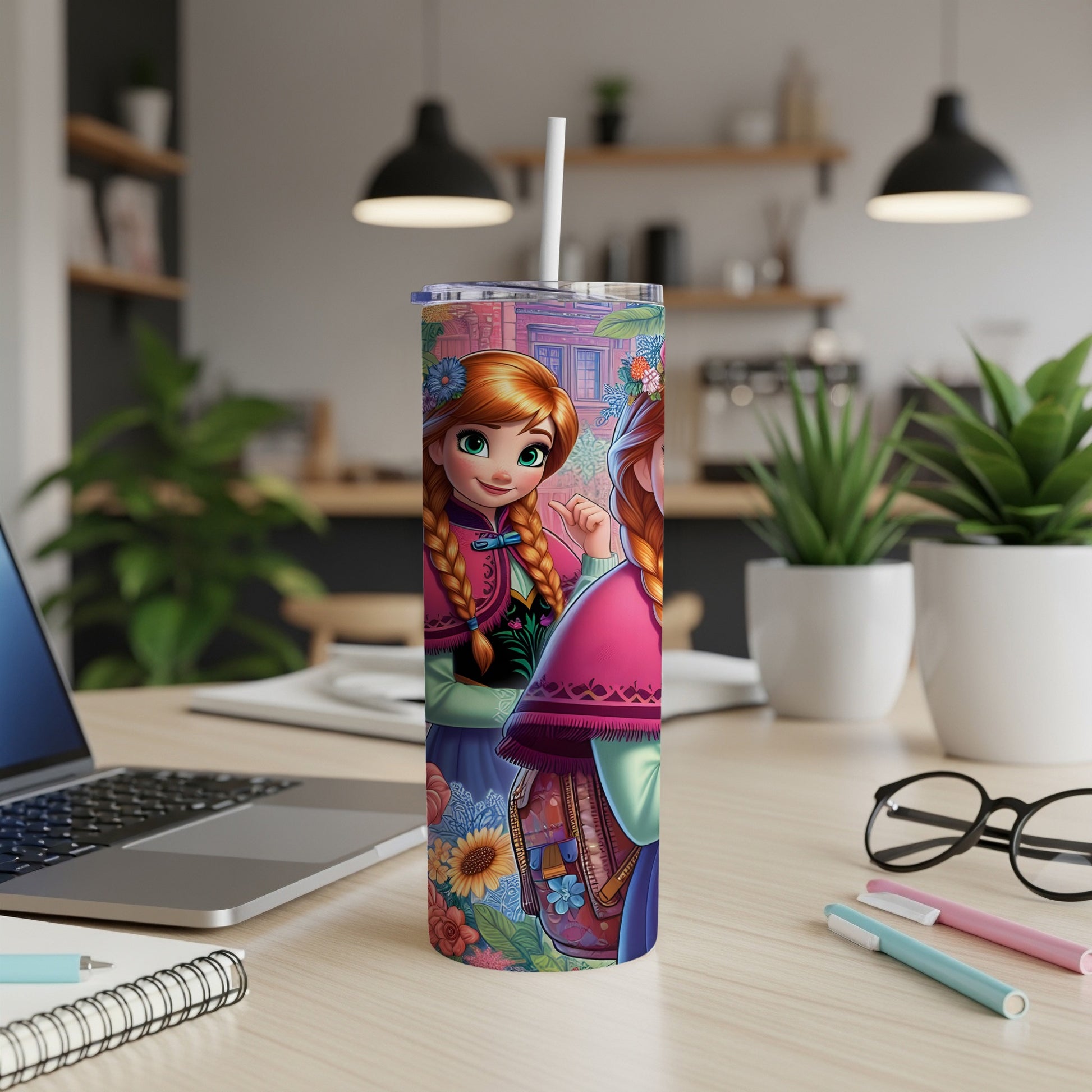 Two cartoon characters, Anna and Elsa, on a colorful tumbler with floral designs.