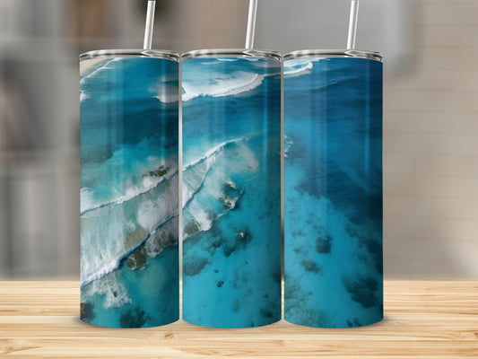Three tumblers with ocean waves and beach aerial view design.