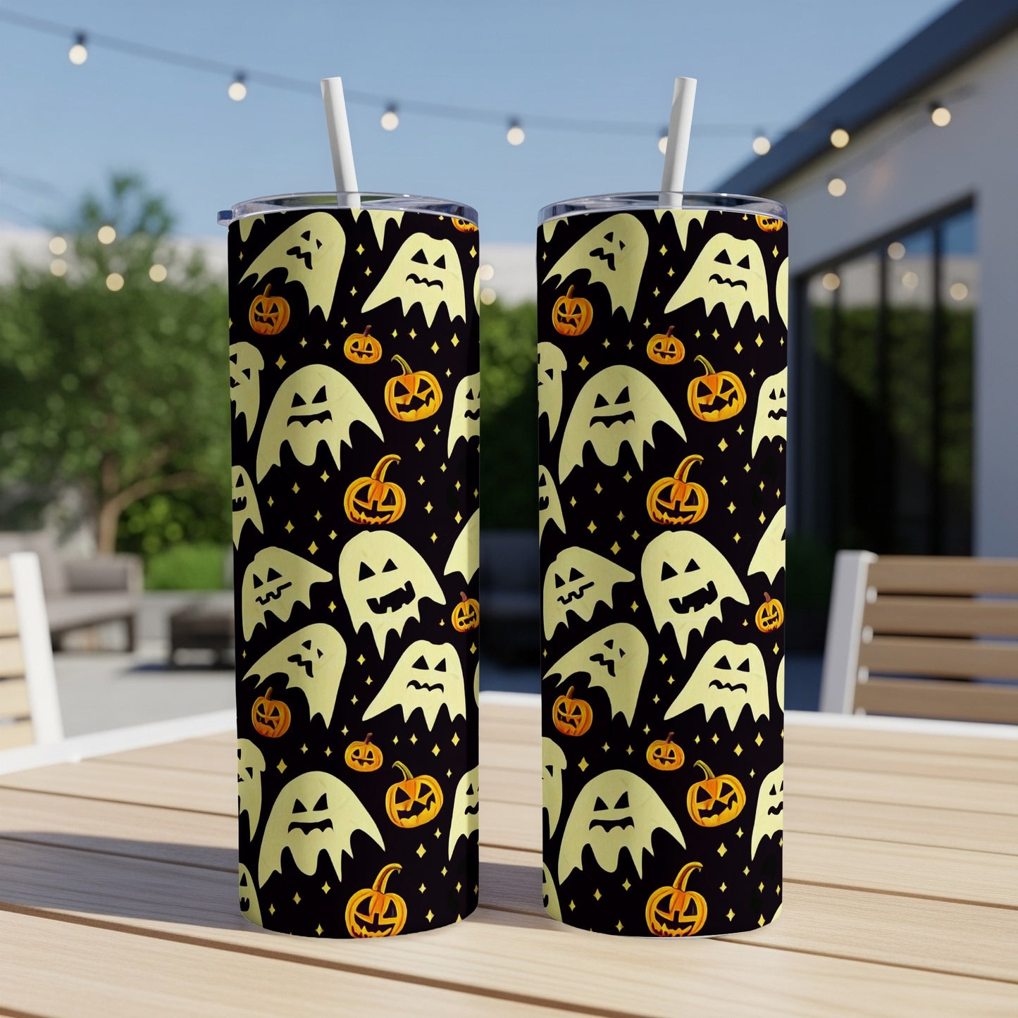 Two tumblers with a black background featuring a repeating pattern of ghosts and jack-o'-lanterns.
