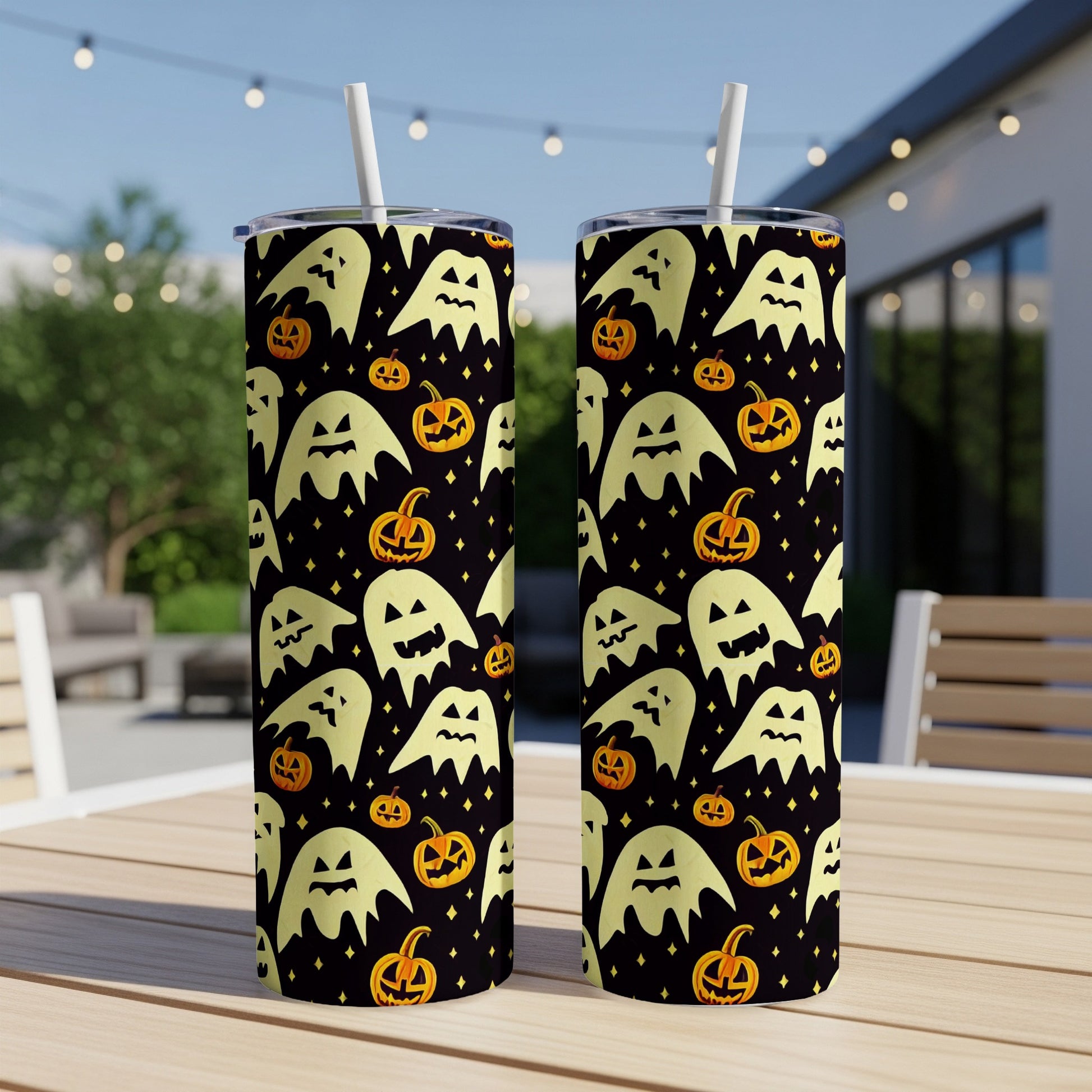 Two tumblers with a black background featuring a repeating pattern of ghosts and jack-o'-lanterns.