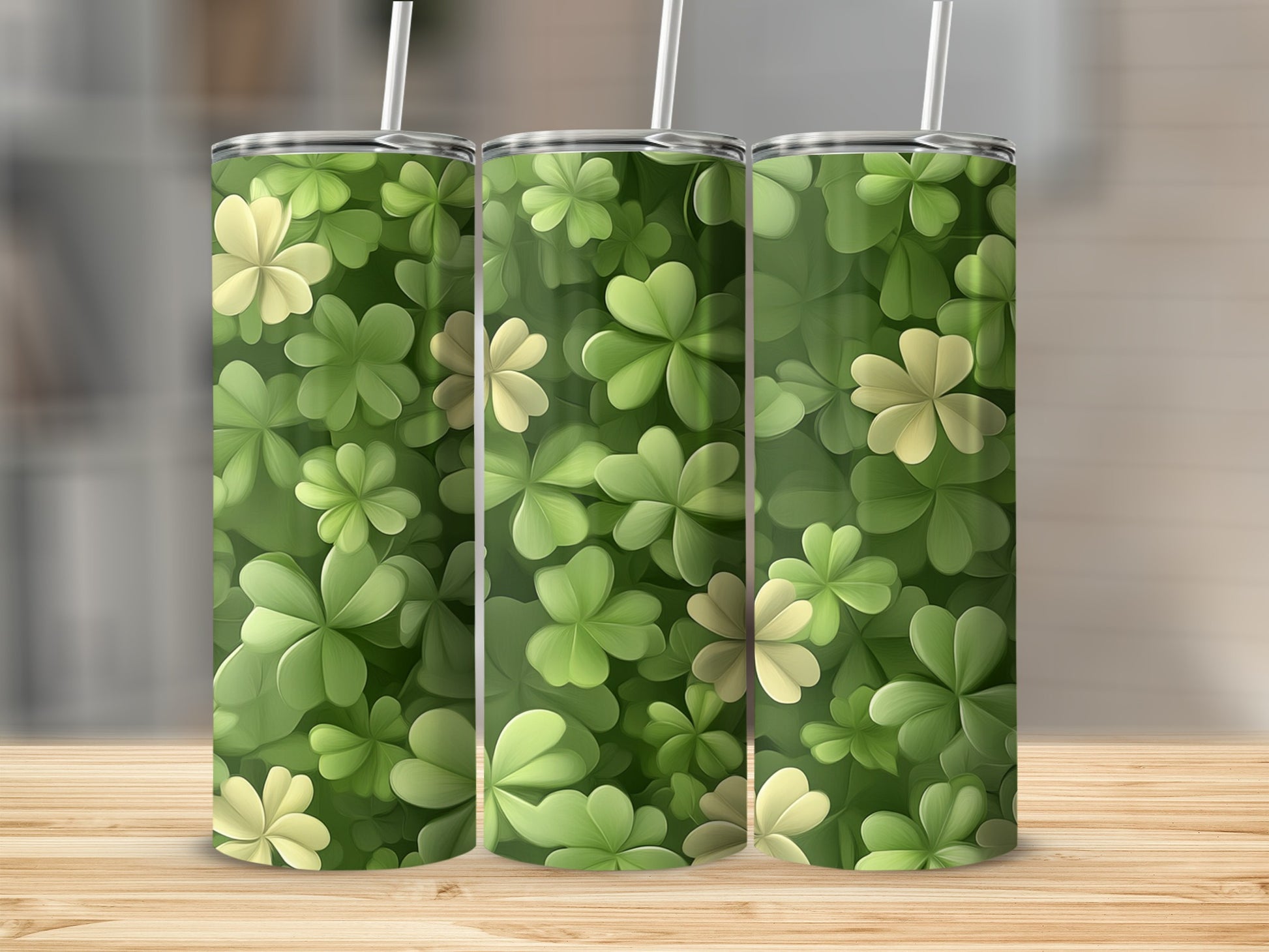 Three tumblers with a seamless pattern of green and light green clover leaves.