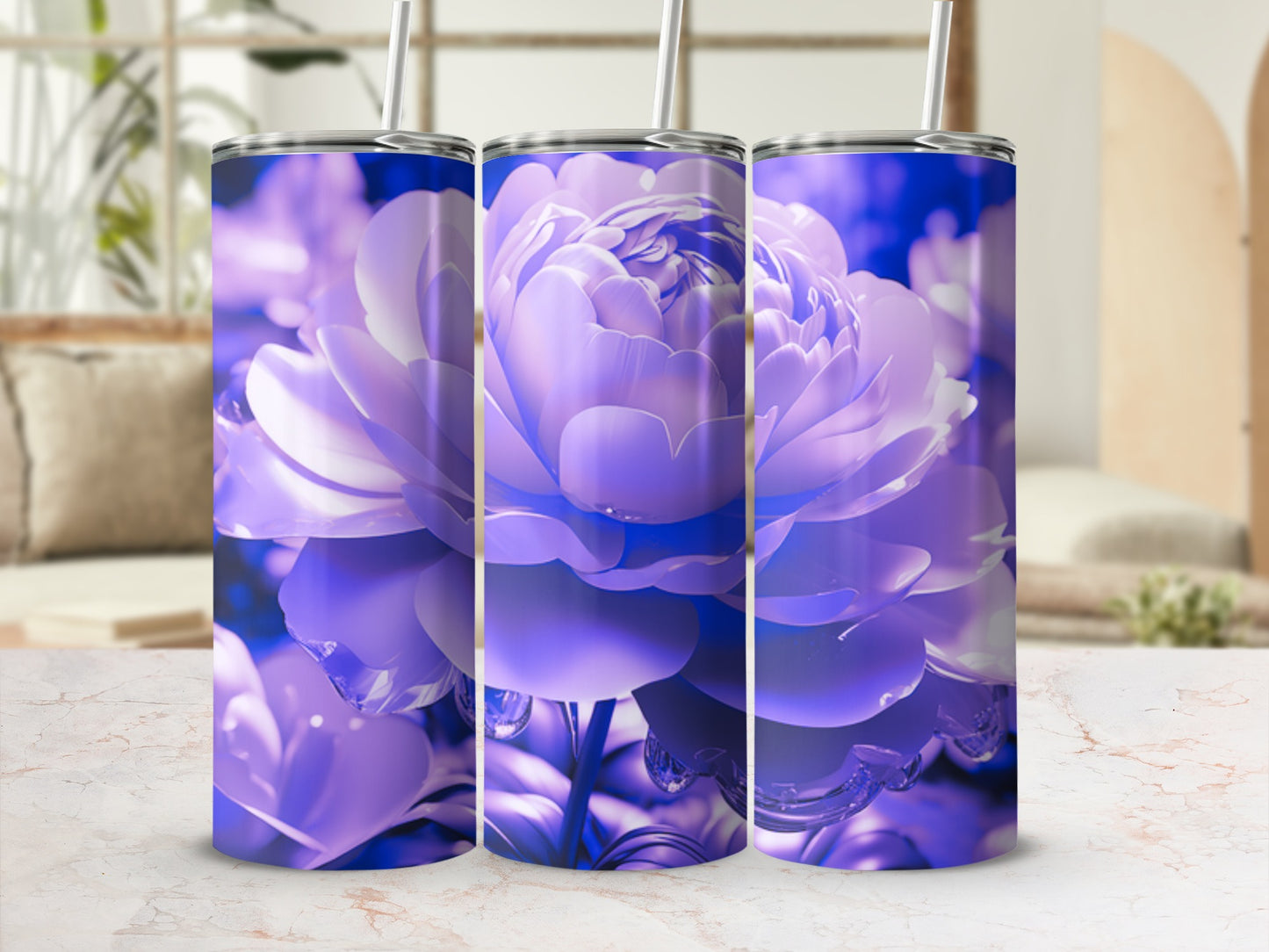 Three purple floral tumblers with straws displayed on a marble countertop.