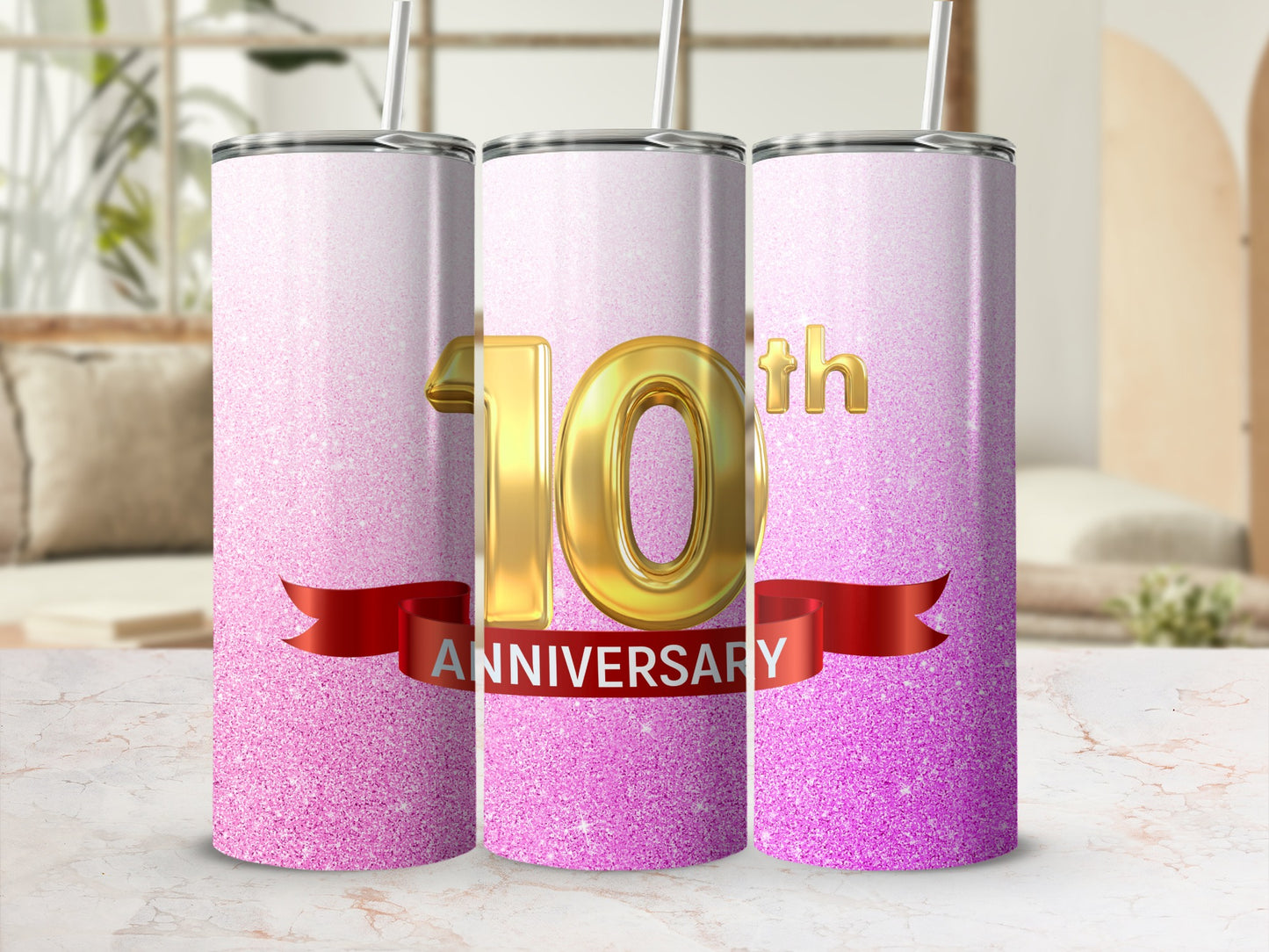 Gold "10th Anniversary" text on pink glitter tumbler.
