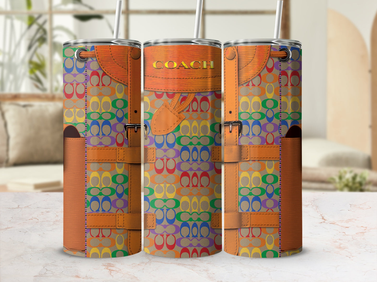 Three tumblers with rainbow Coach pattern and brown straps, one says COACH.