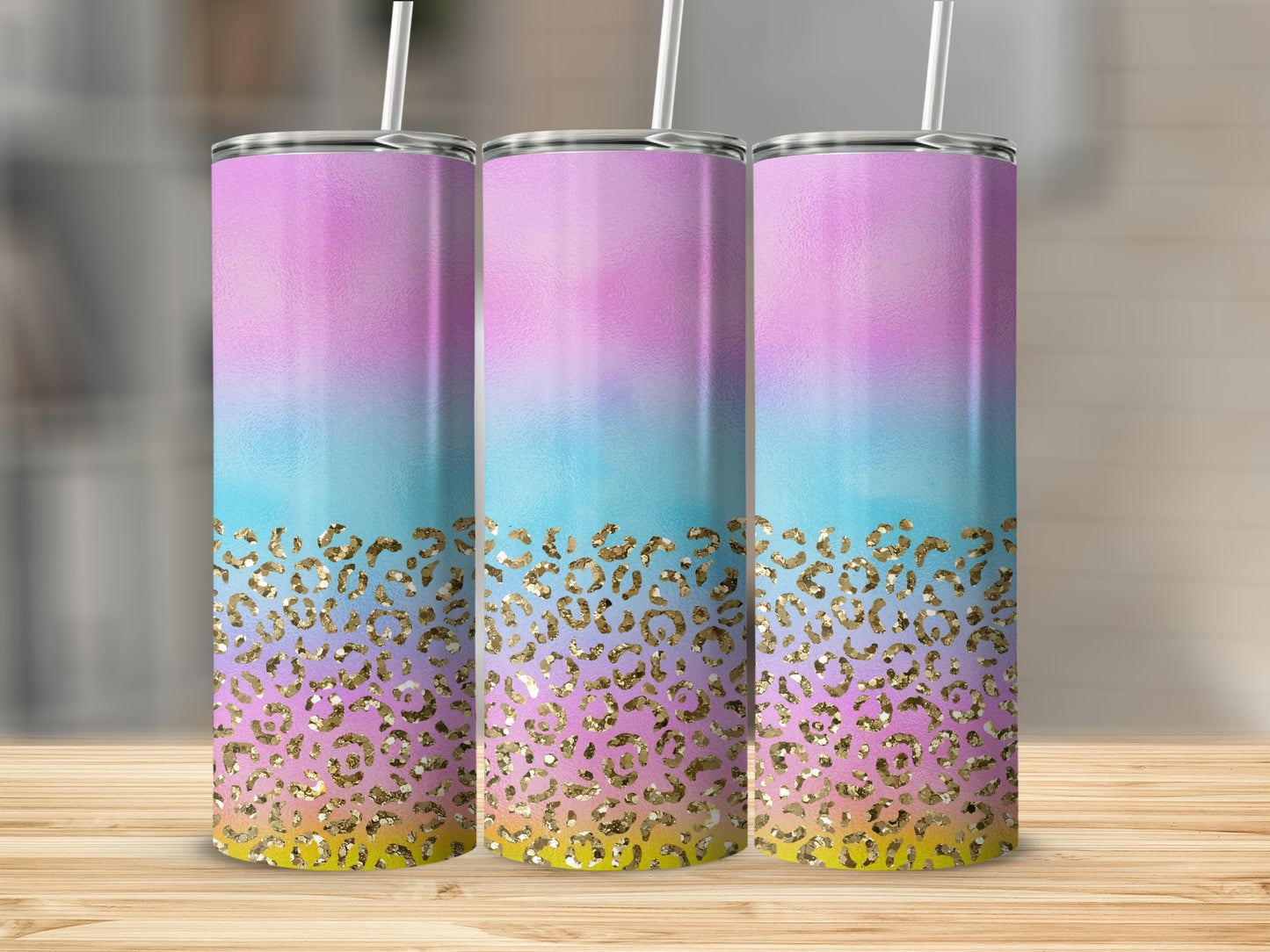 Three tall tumblers with a pastel ombre and gold leopard print design.