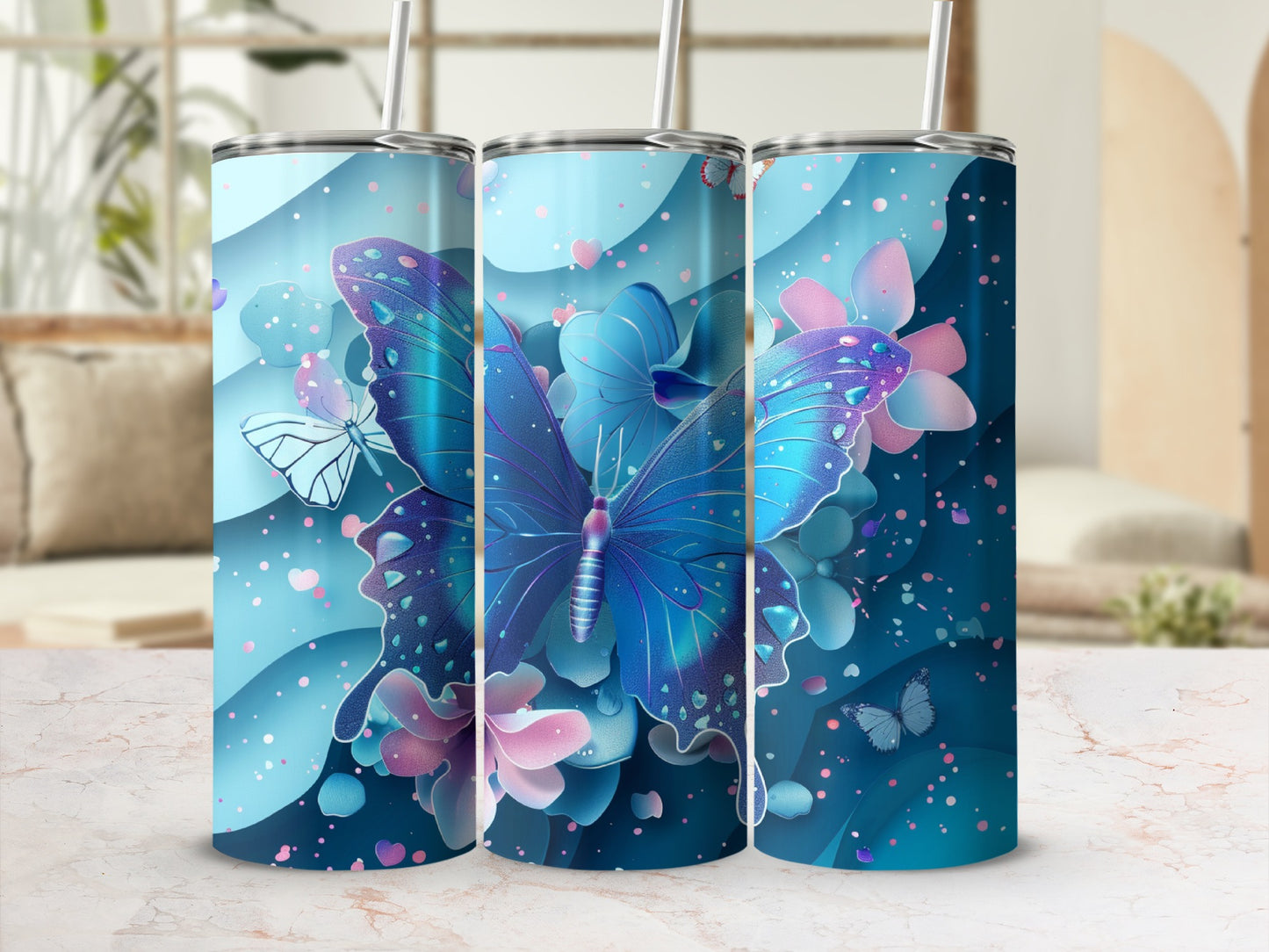 Blue butterfly and floral design on a blue tumbler with straw.