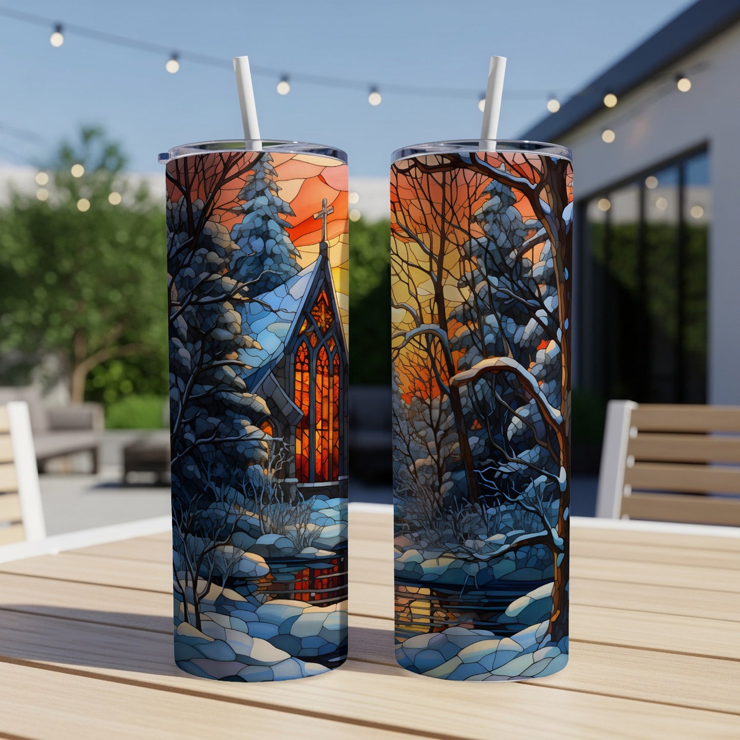 Two tumblers displaying a stained-glass church scene in a snowy forest.