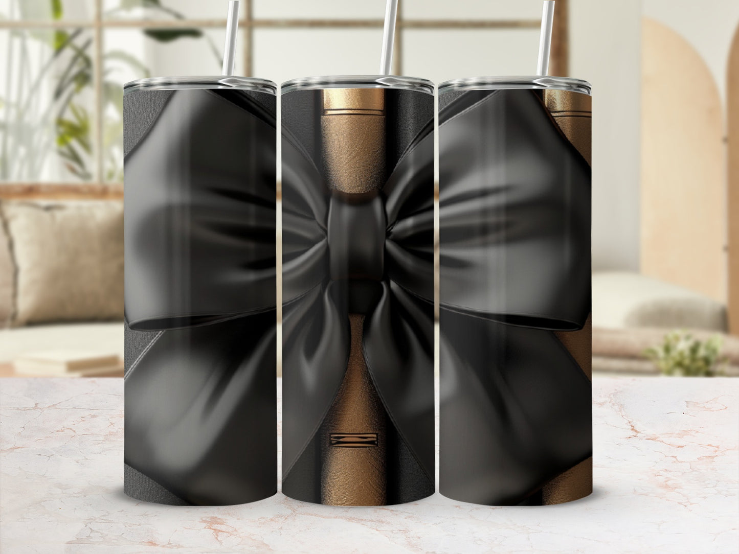 Three tumblers with black bow design against a blurred background.