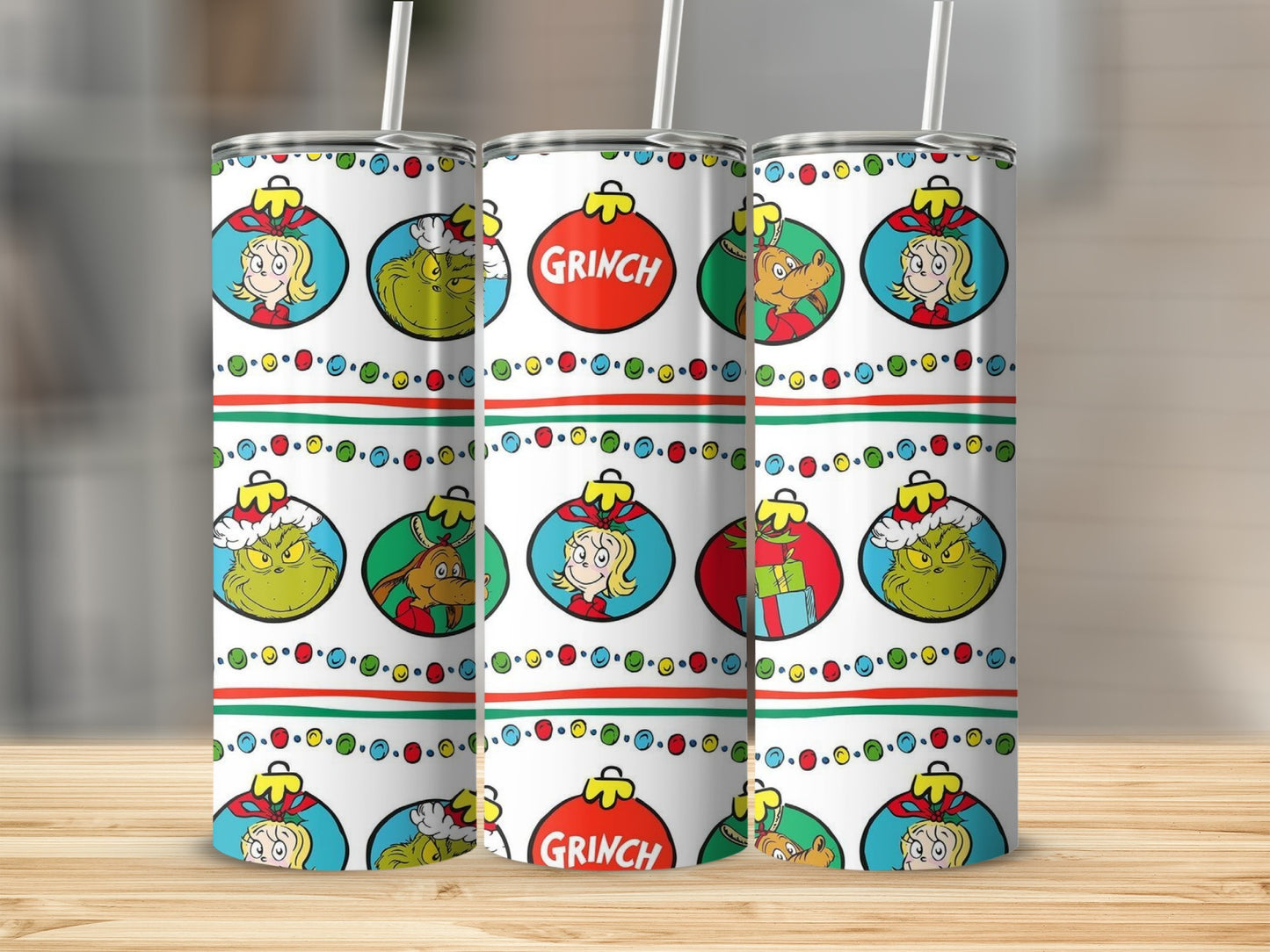 Three tall cups with The Grinch holiday ornaments and Grinch characters.