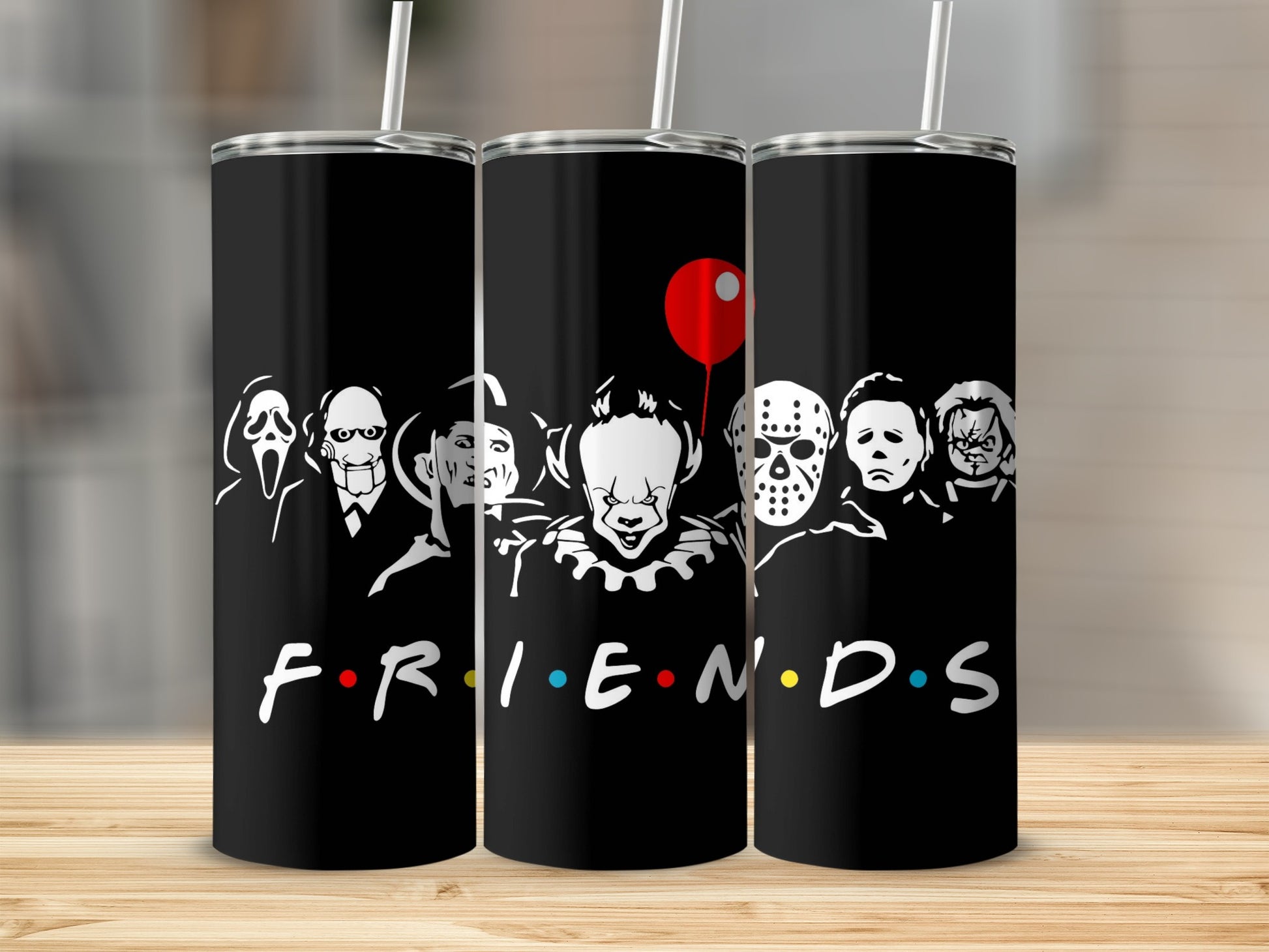Black tumblers with horror characters and the Friends logo.