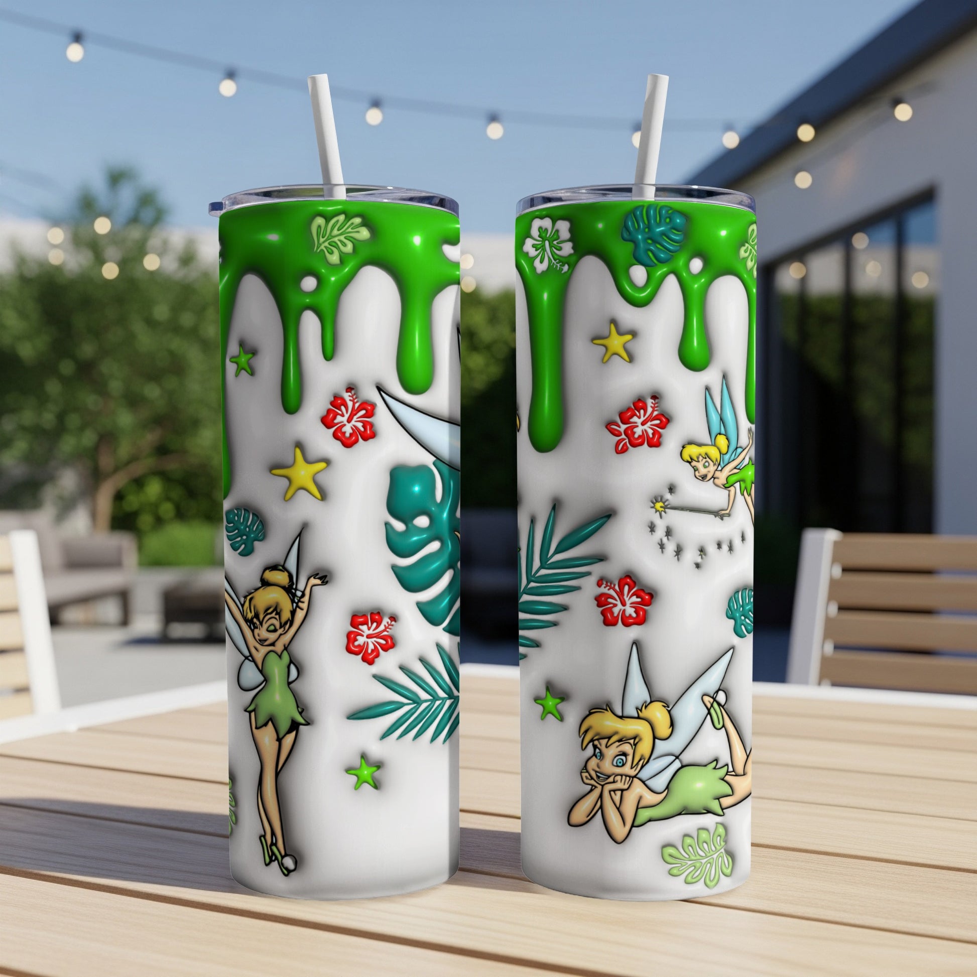 Two Tinkertoys tumblers with green drip design and tropical foliage.