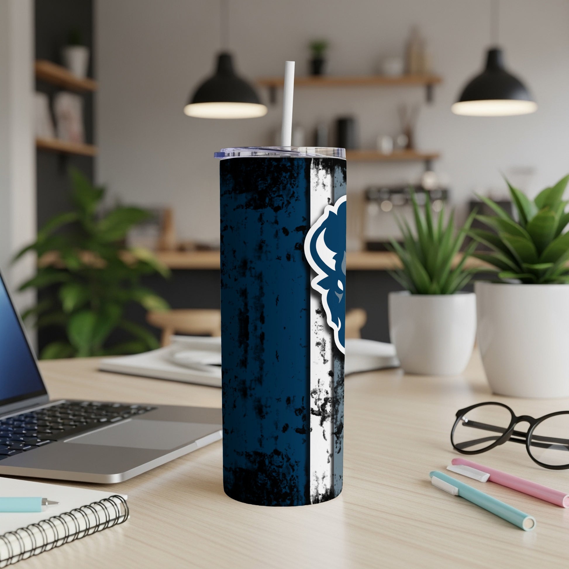 Tumbler with distressed navy blue and white design featuring a blue lion logo.