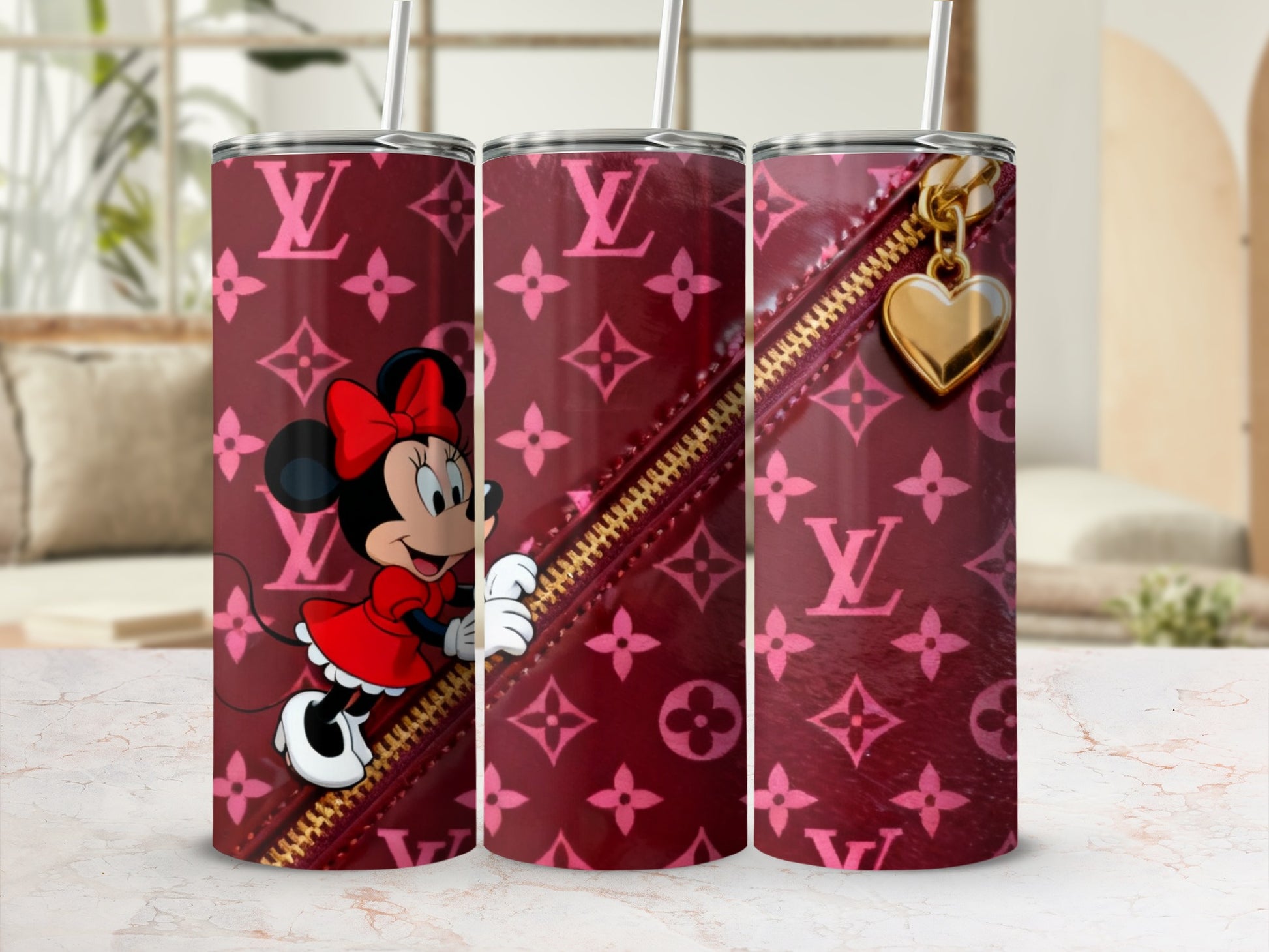 Minnie Mouse on a pink monogrammed tumbler with a gold zipper detail.