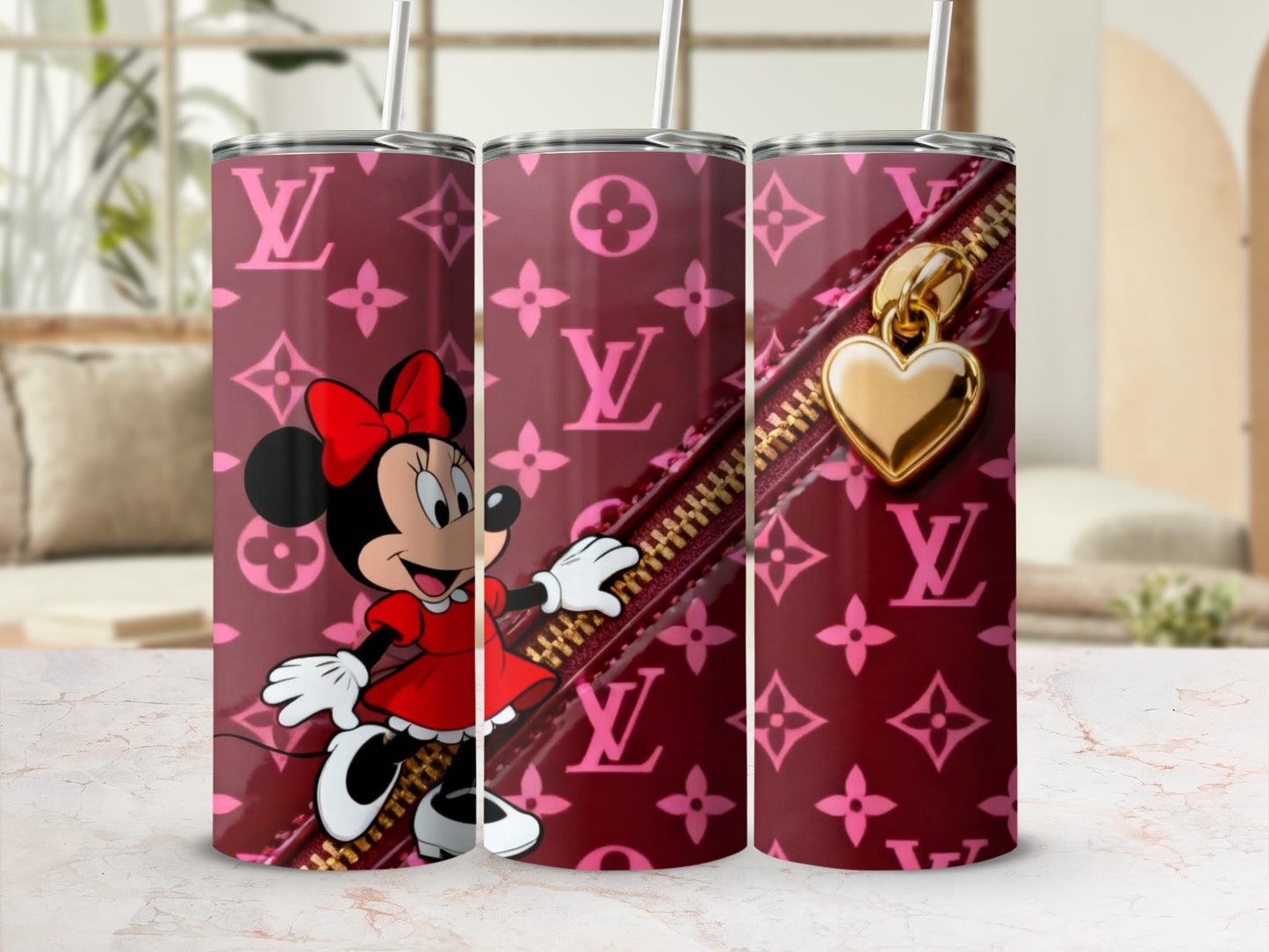Minnie Mouse on a maroon Louis Vuitton print tumbler with a gold heart zipper charm.