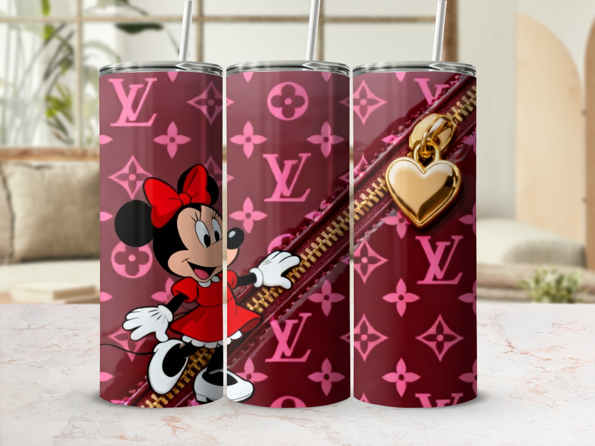 Minnie Mouse on a maroon Louis Vuitton print tumbler with a gold heart zipper charm.