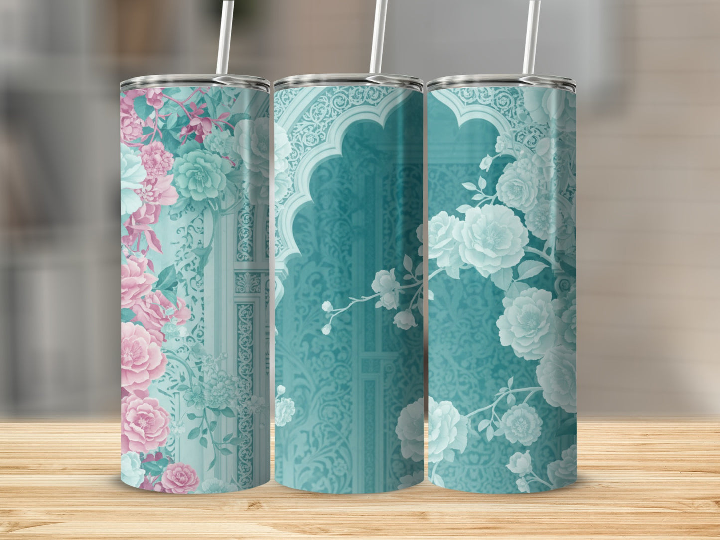 Three tumblers with floral patterns and arched window designs.