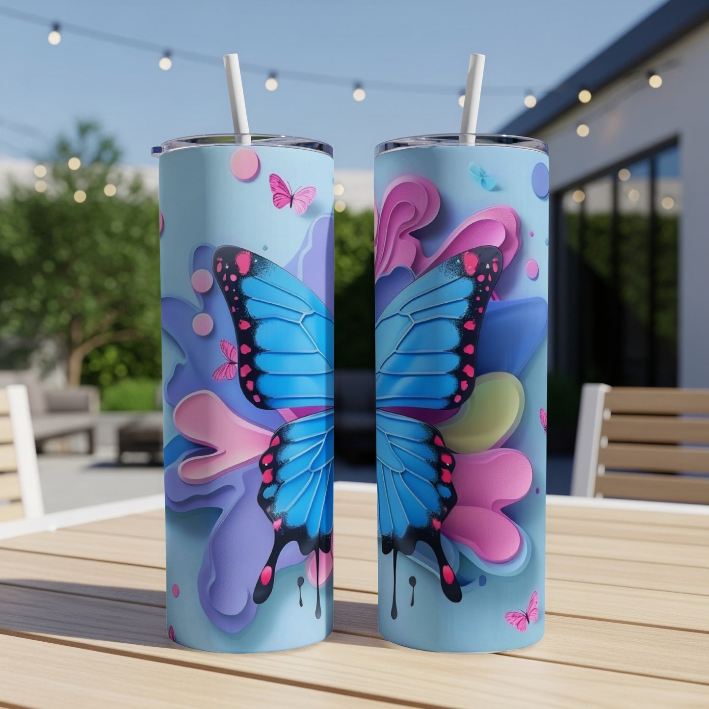 Two blue butterfly tumblers with pink and purple floral accents.